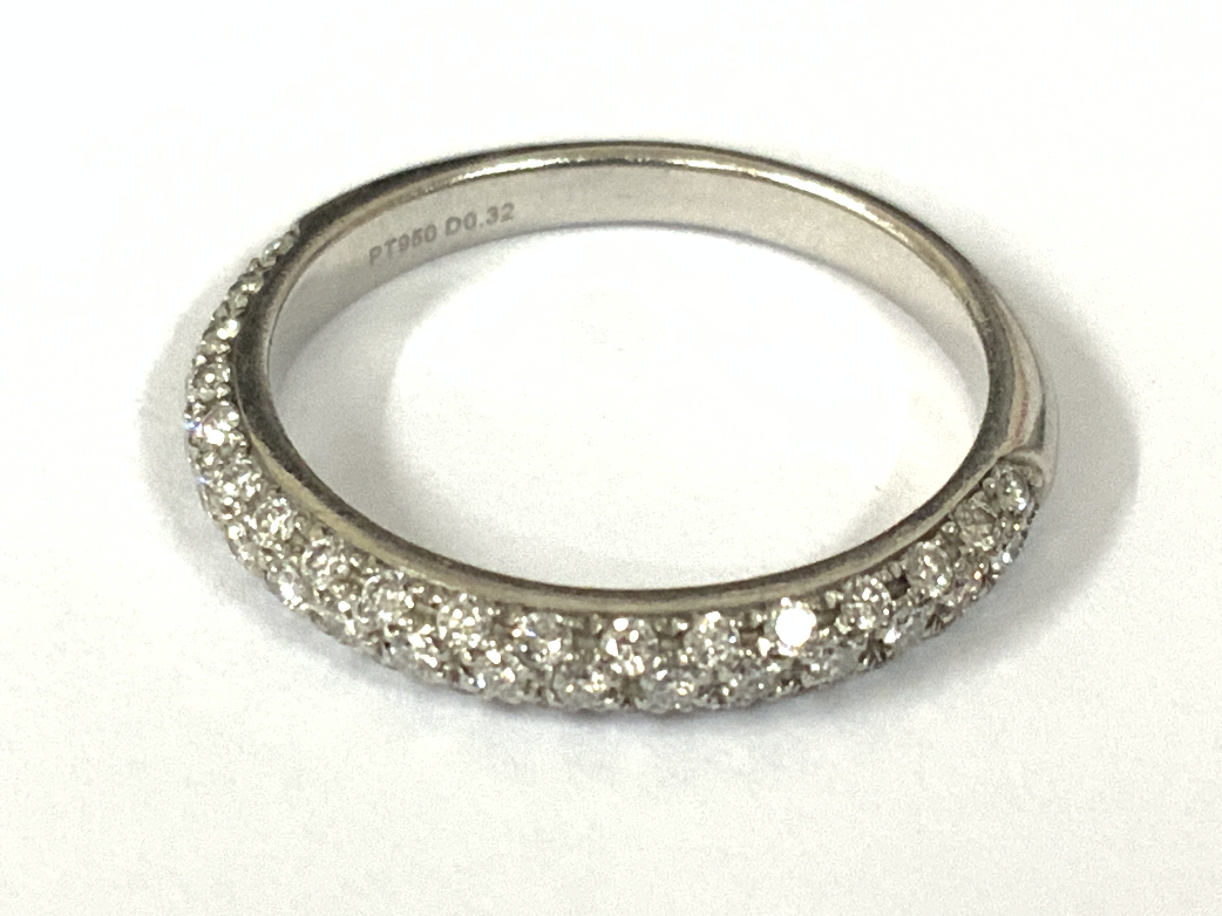 Platinum three quarter eternity ring set with RBC diamonds. Diamonds 0.32ct. Approx ring size I/J. Postage category A