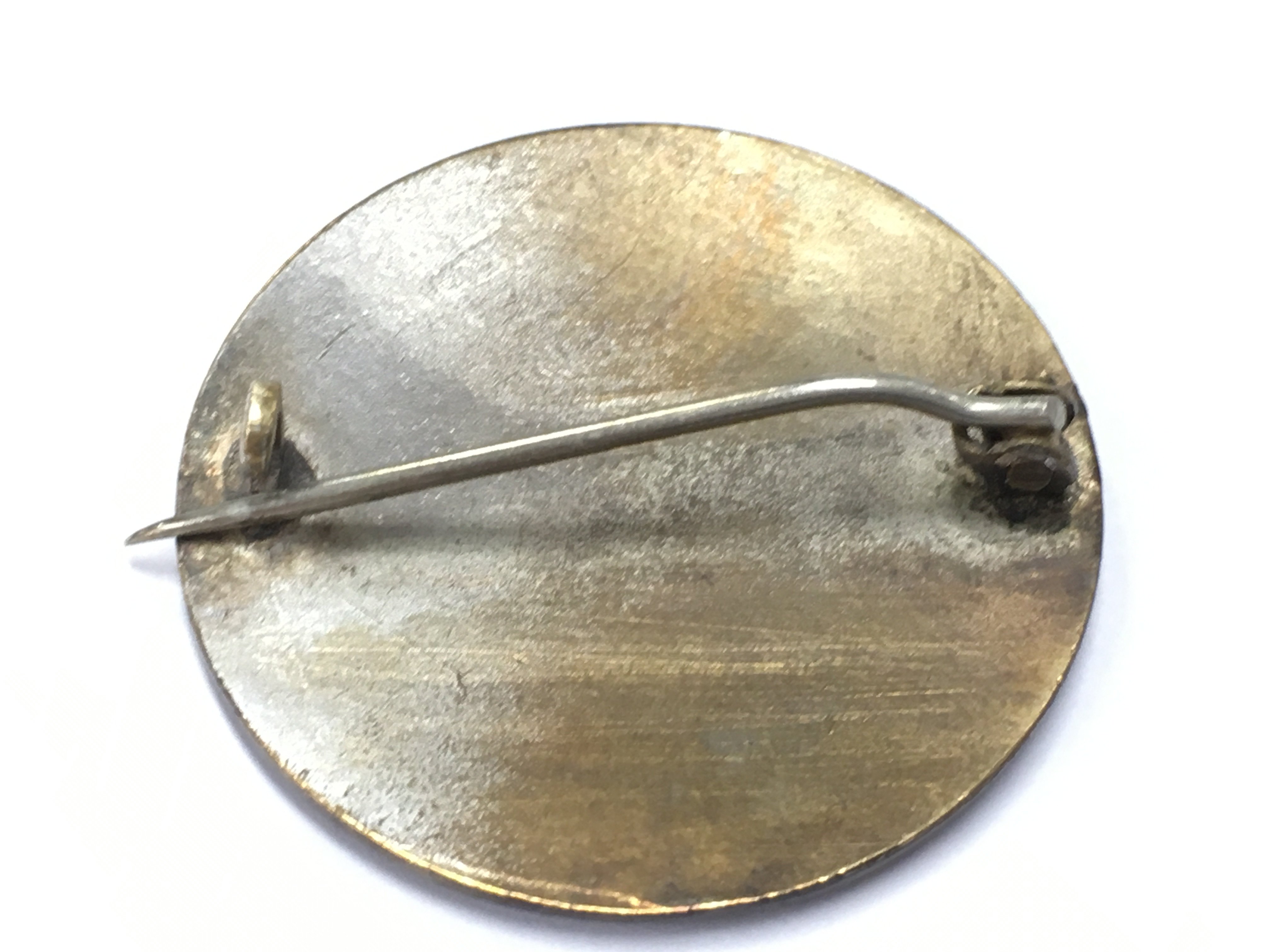 An unmarked enamel brooch , postage category A NO RESERVE