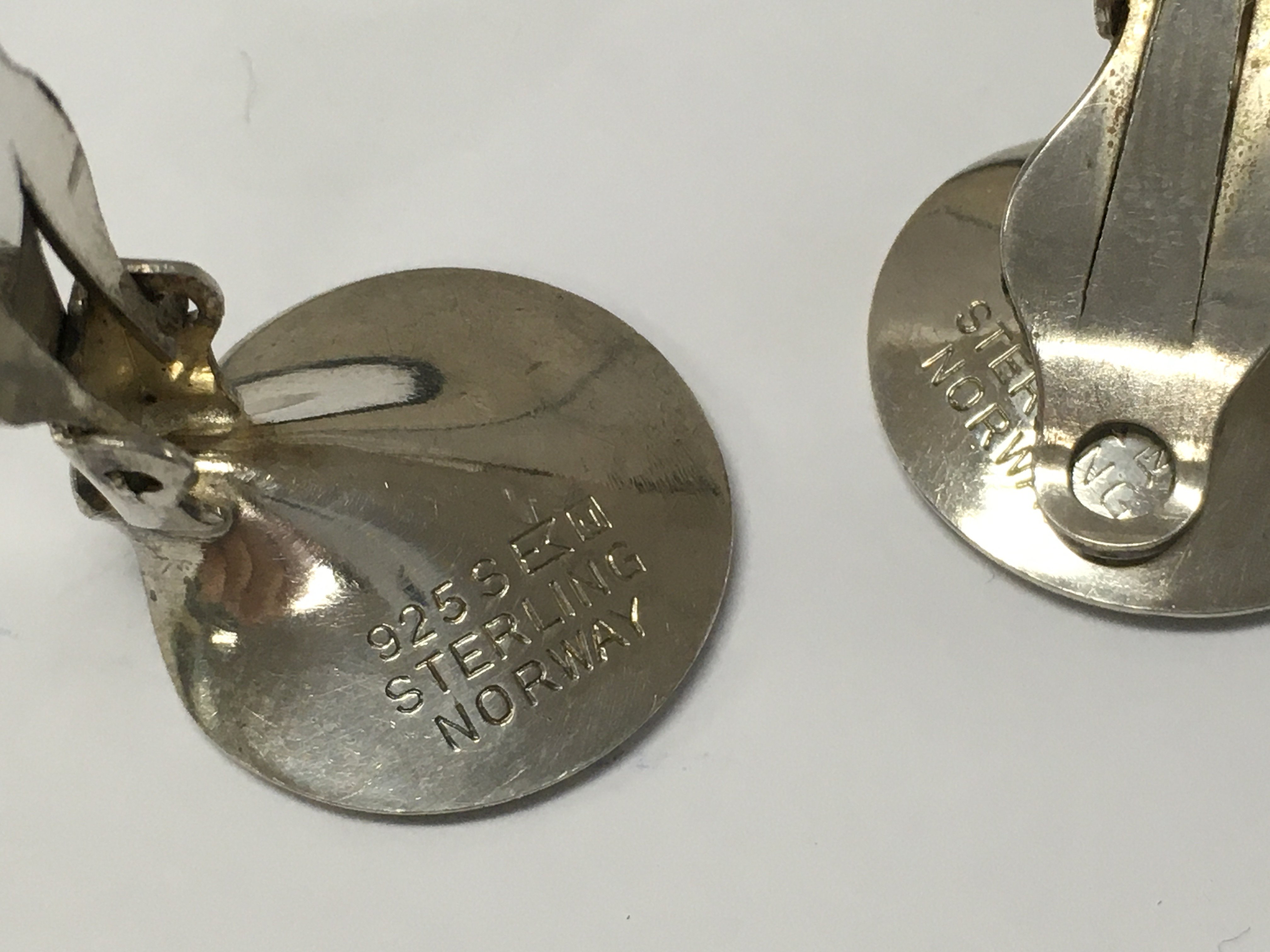 A pair of red silver earrings . Postage category A