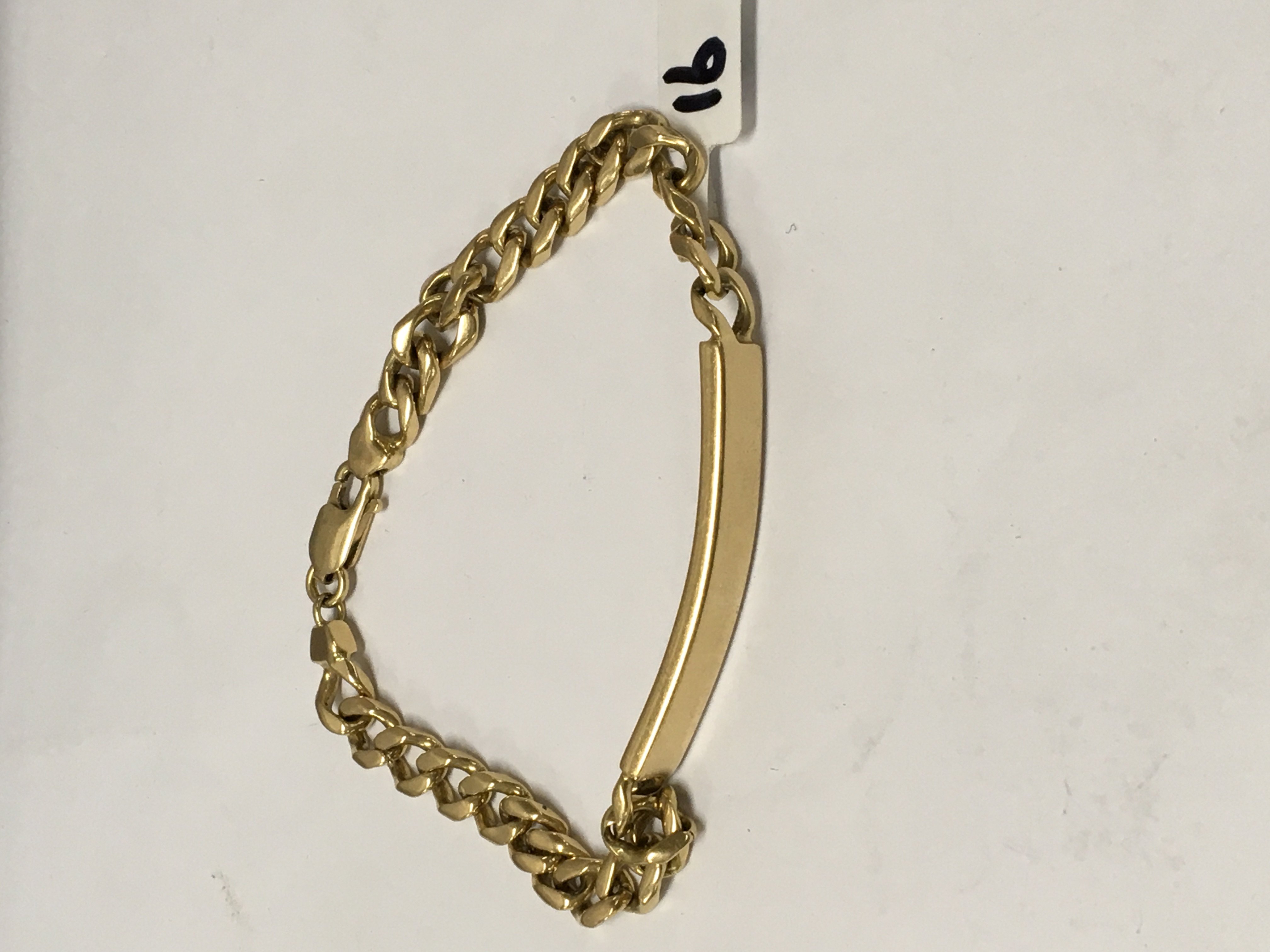 A 18 ct gold ID bracelet 32 grams .