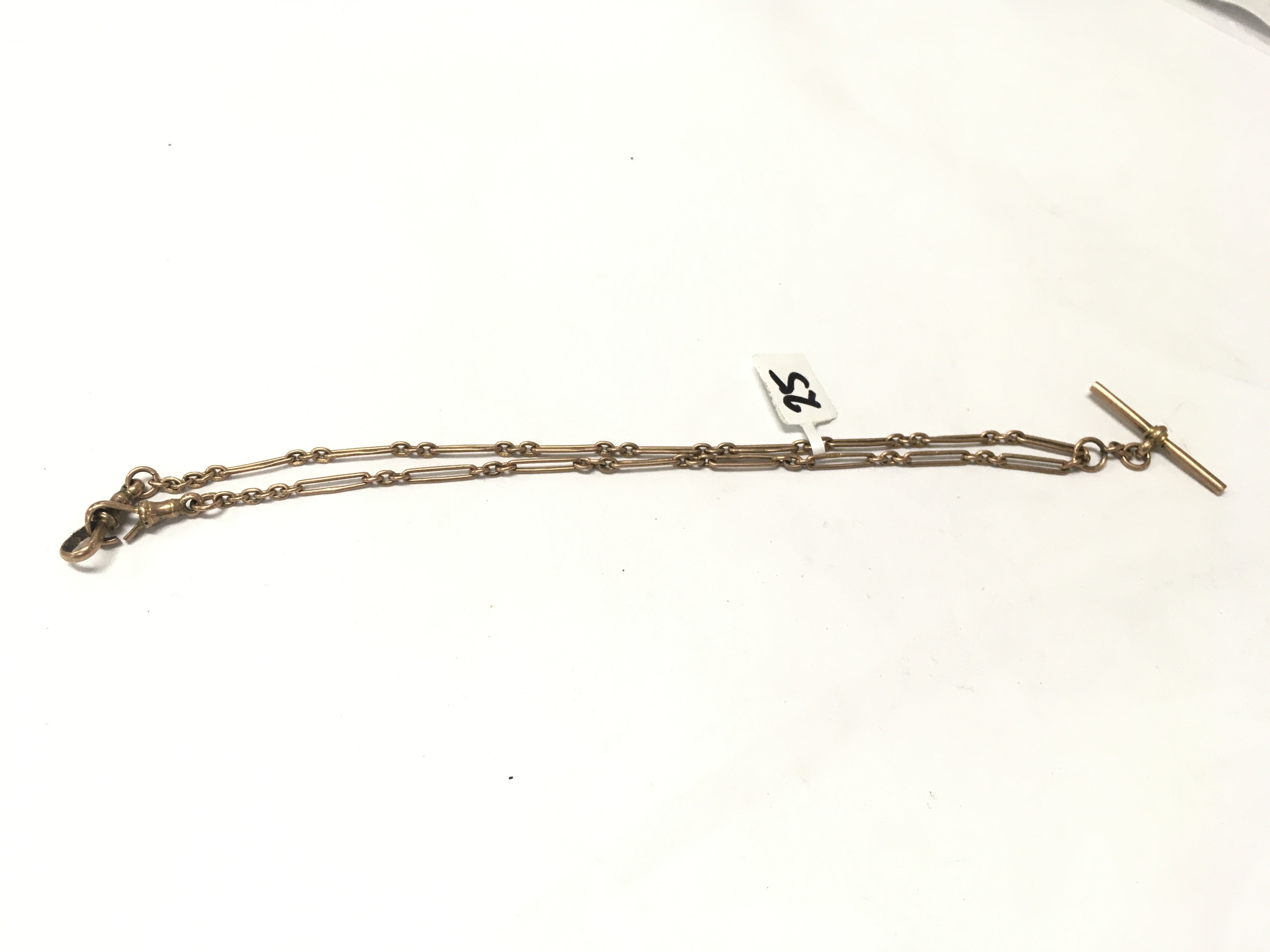 A 9ct gold long link Albert chain with a hanging t-bar , Approx weight 9 grams.