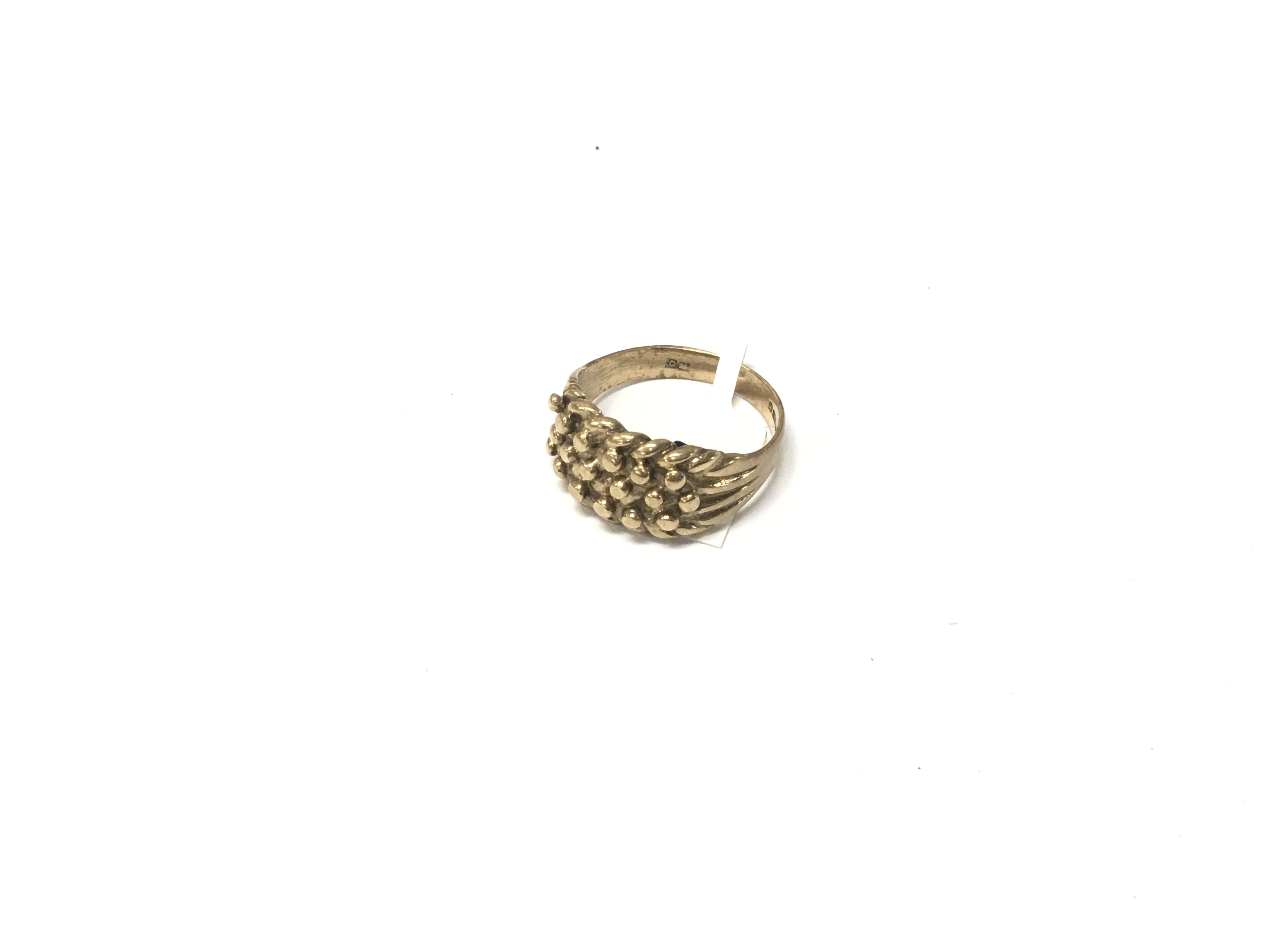 A 9ct gold keeper ring, Approx weight 6.4 grams.size s