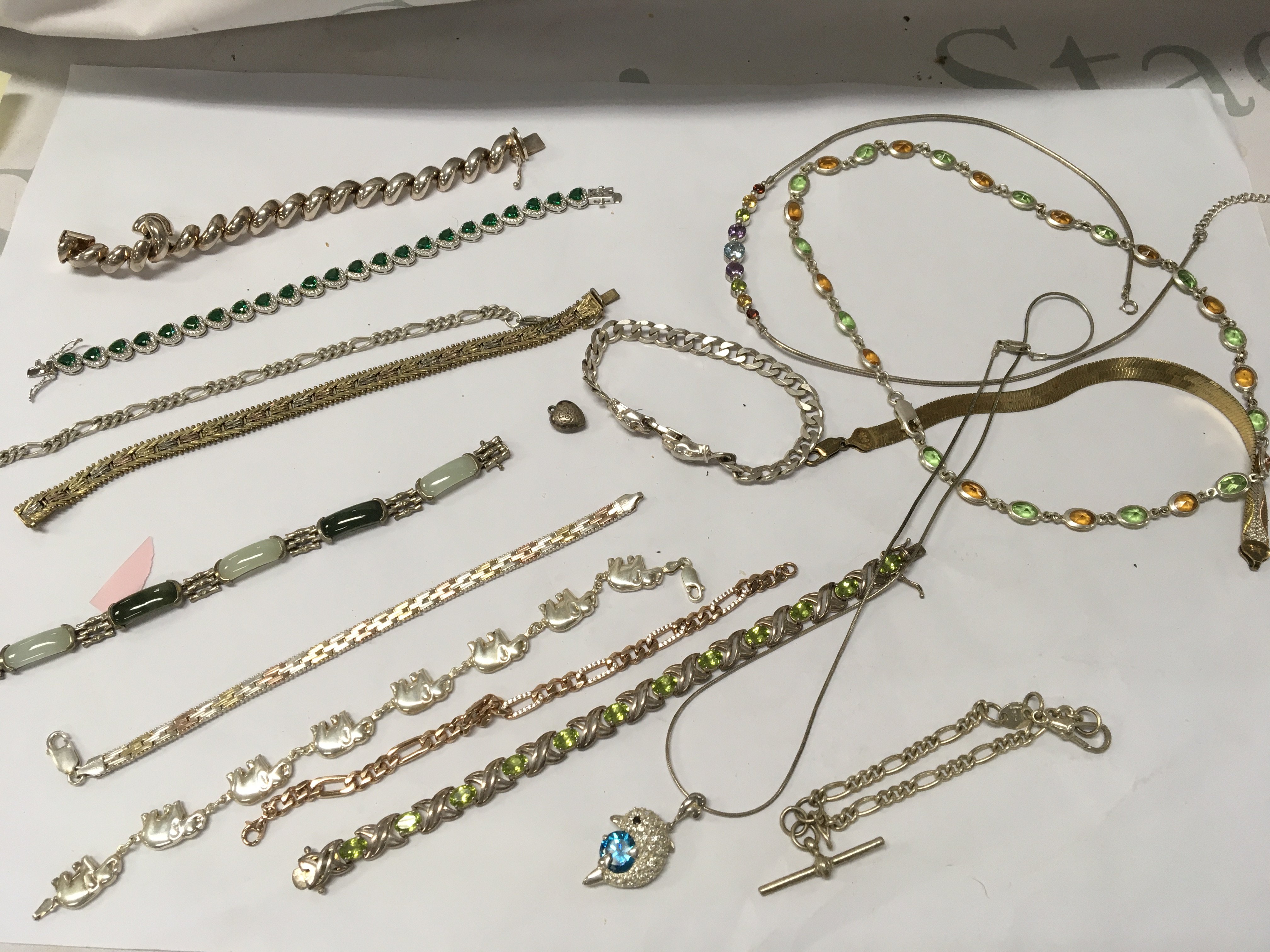 A collection of silver bracelets and necklaces.