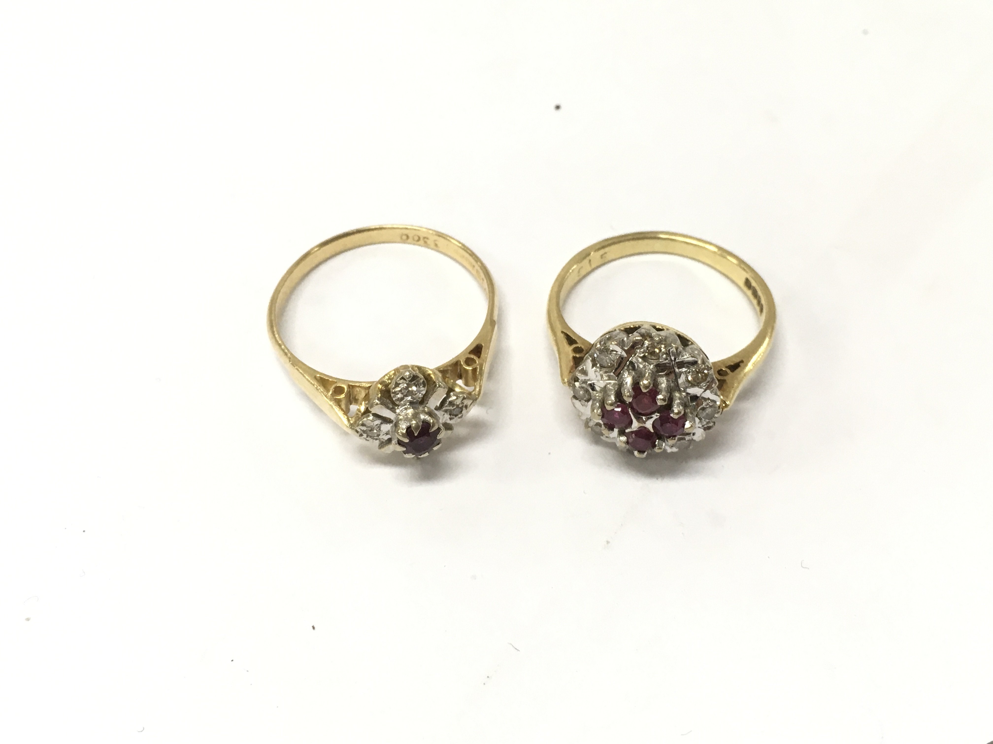 Two 18ct diamond and ruby cluster rings, size J,M1/2. Approx weight 6.4 grams.