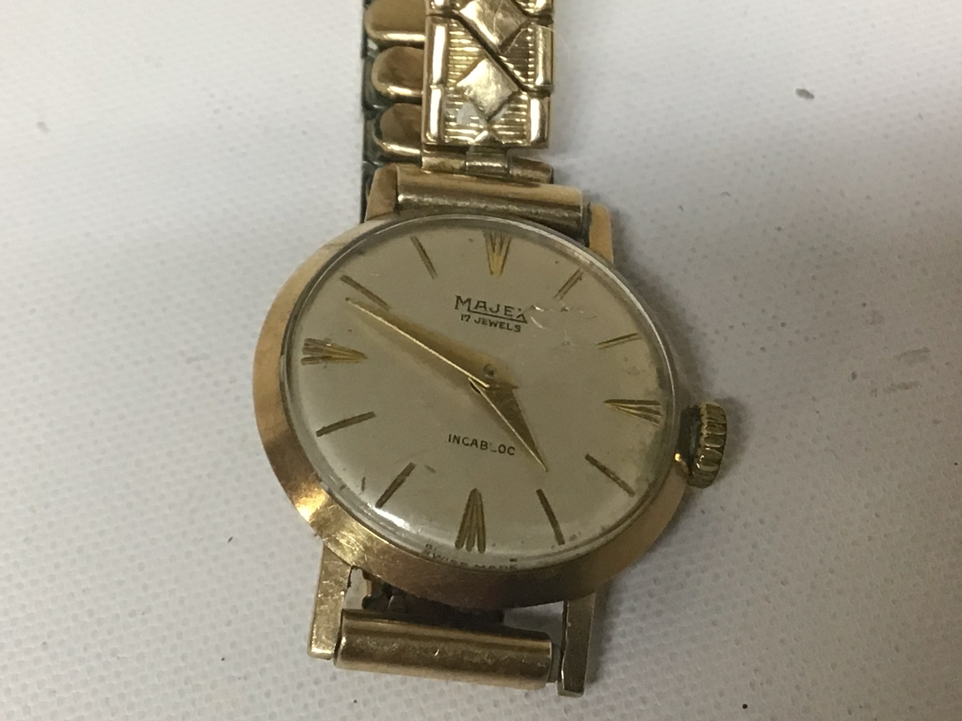 A ladies 9carat gold cased watch Majex with a gold plated strap.