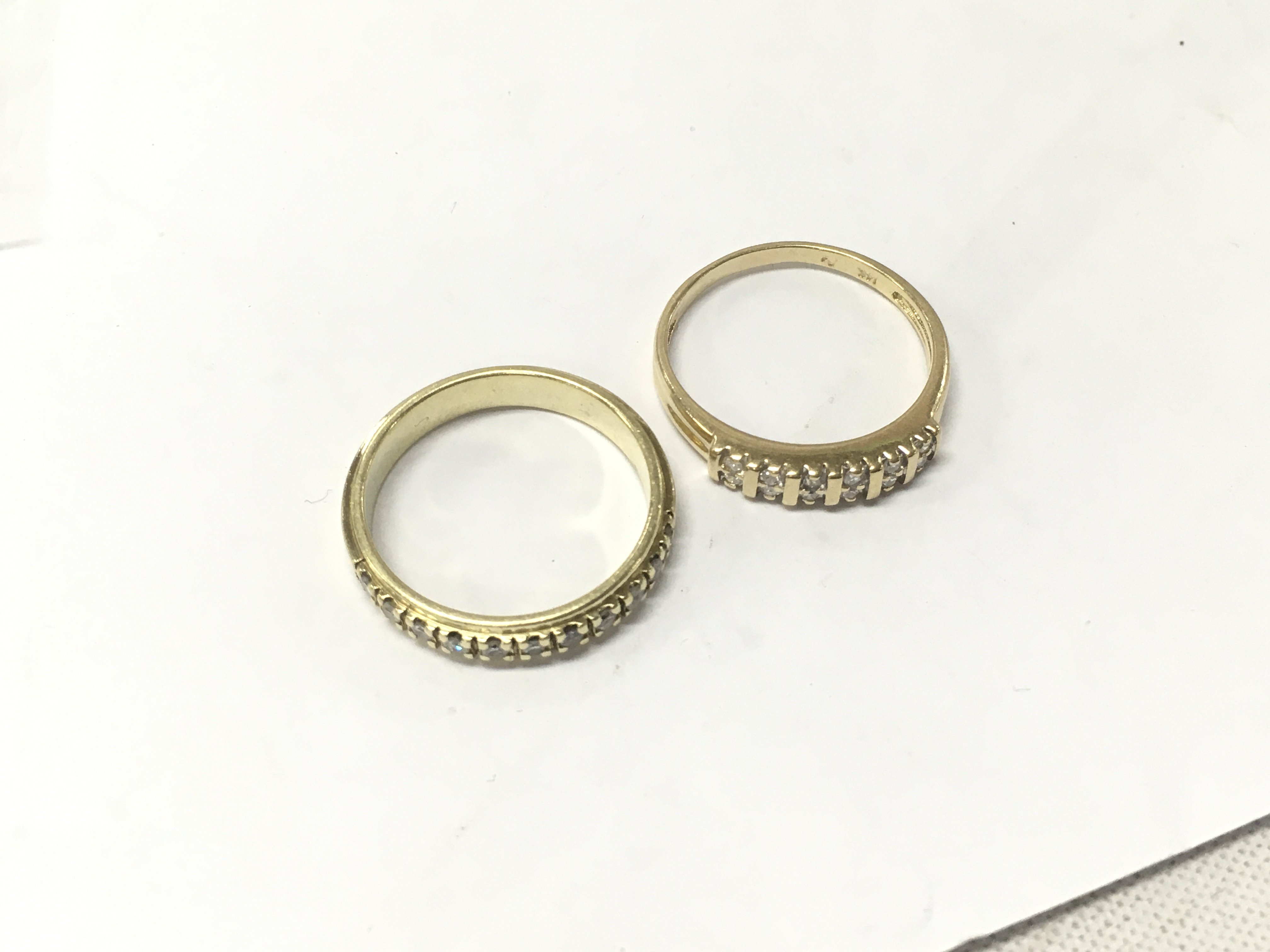 Two 14ct gold half diamond eternity rings. Approx weight 6.3 grams, size O.