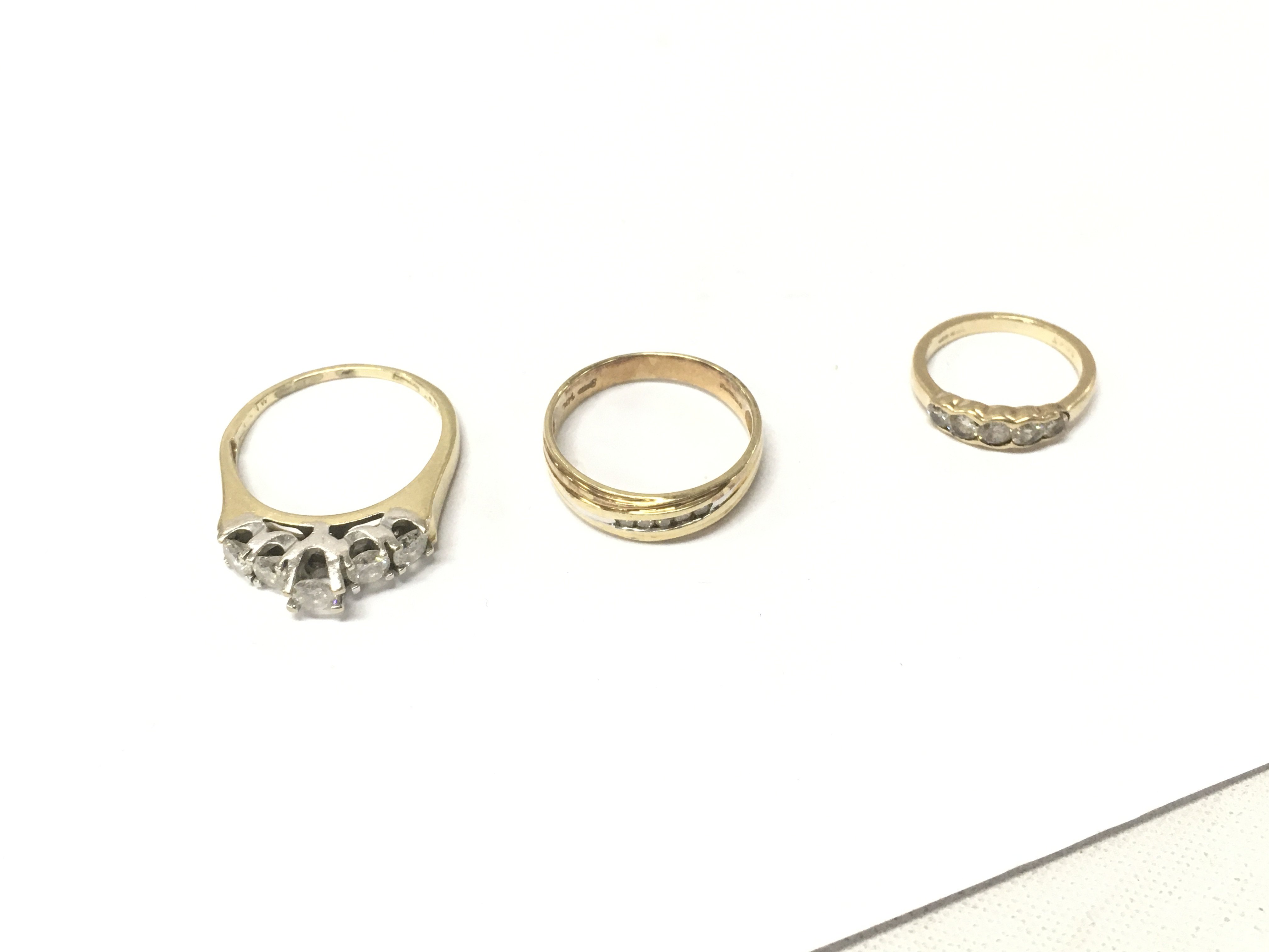 Three 14ct gold five stone diamond rings. Approx weight 8.1 grams, sizes E,O,R.