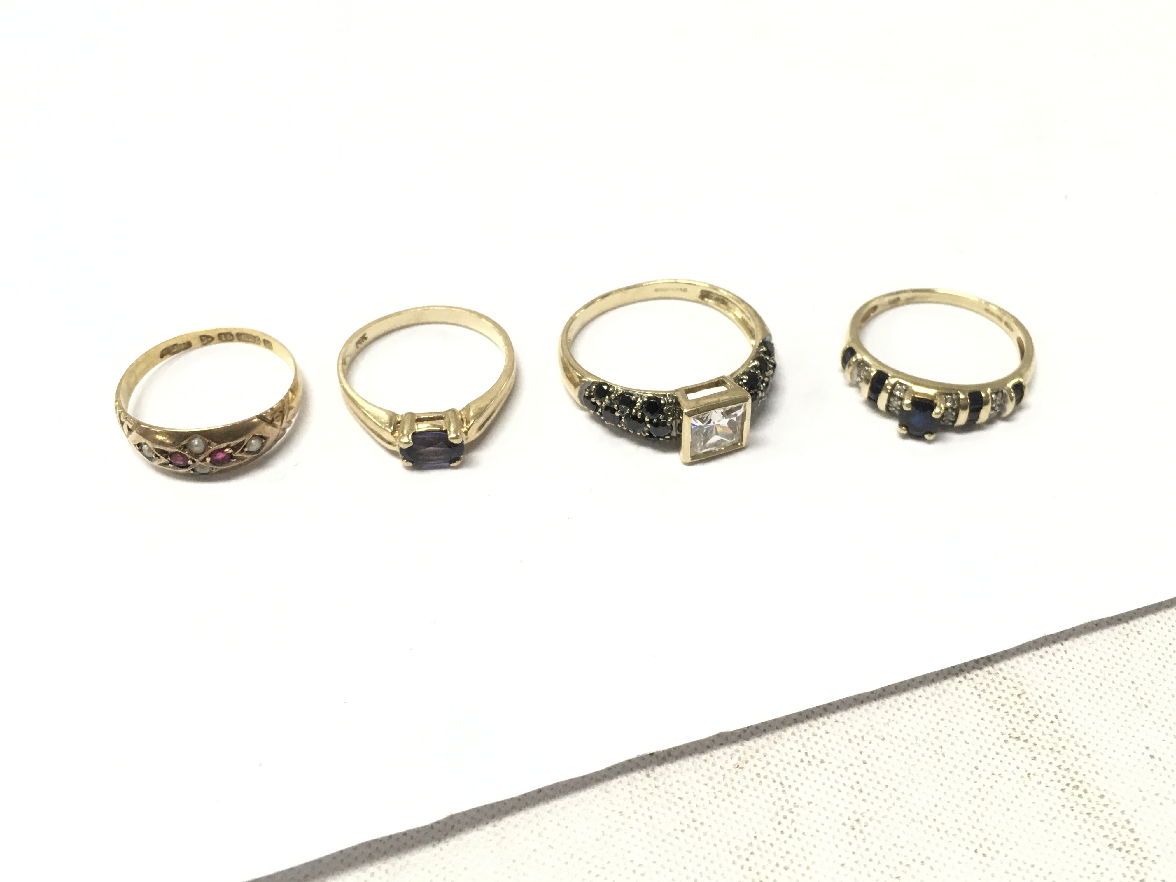 Four 14ct gold mixed stone set rings, approx weight 9.8 grams, size L,N,S.