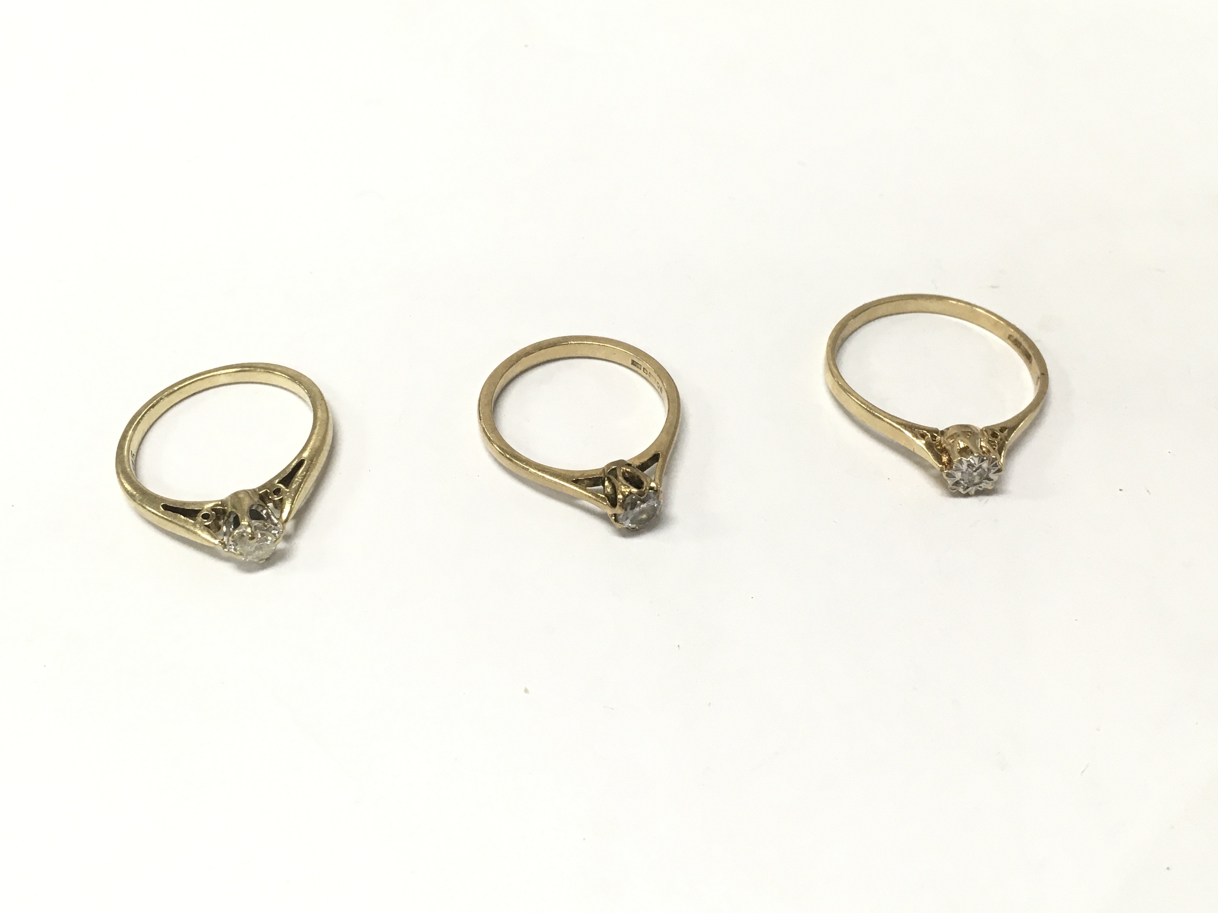 Three 9ct gold diamond solitaire rings, size K,L,R. Approx weight 5.8 grams.