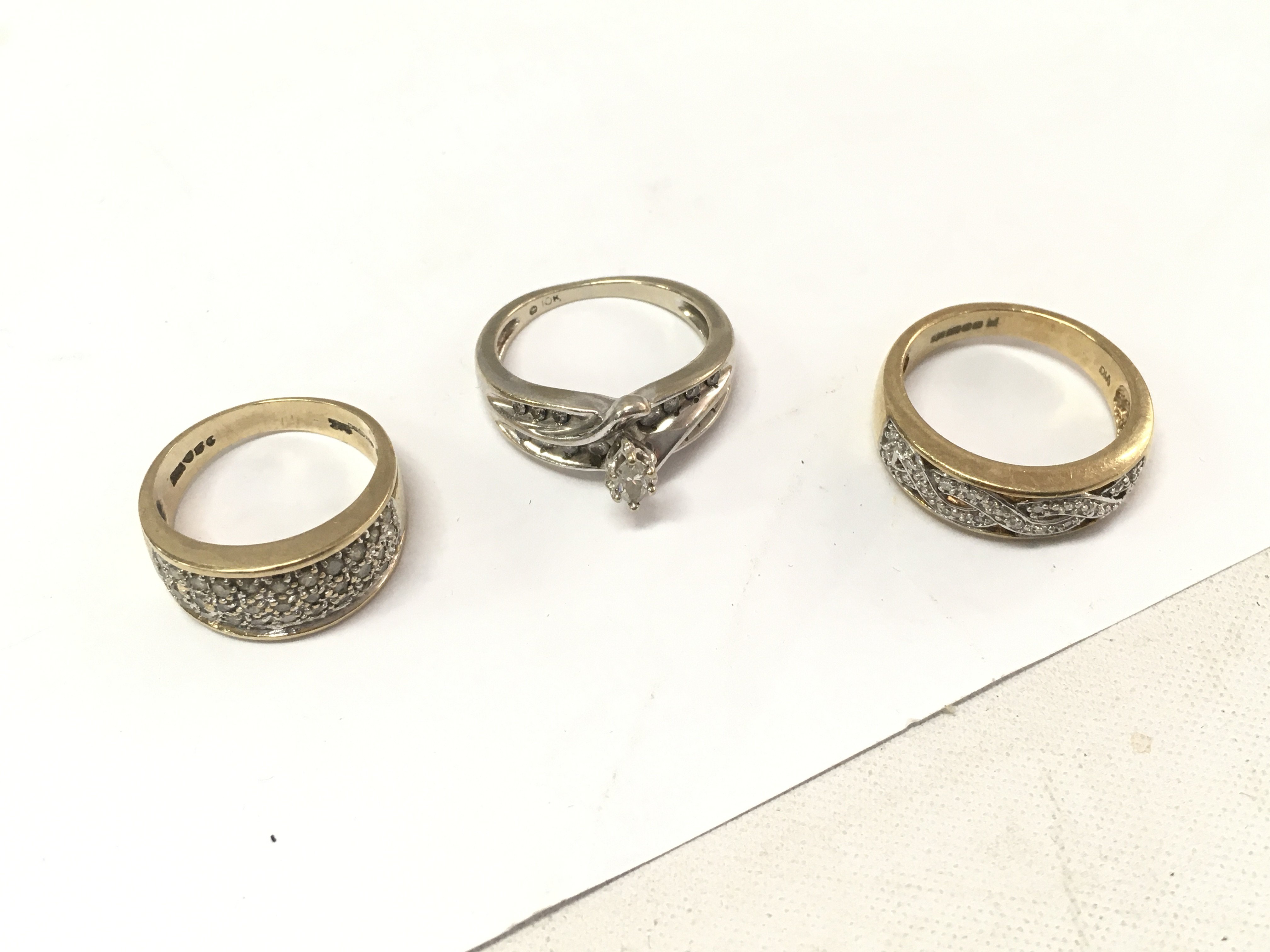 Three 9ct gold diamond cluster bands. Approx weight 12.6 grams, size K,M1/2,N.