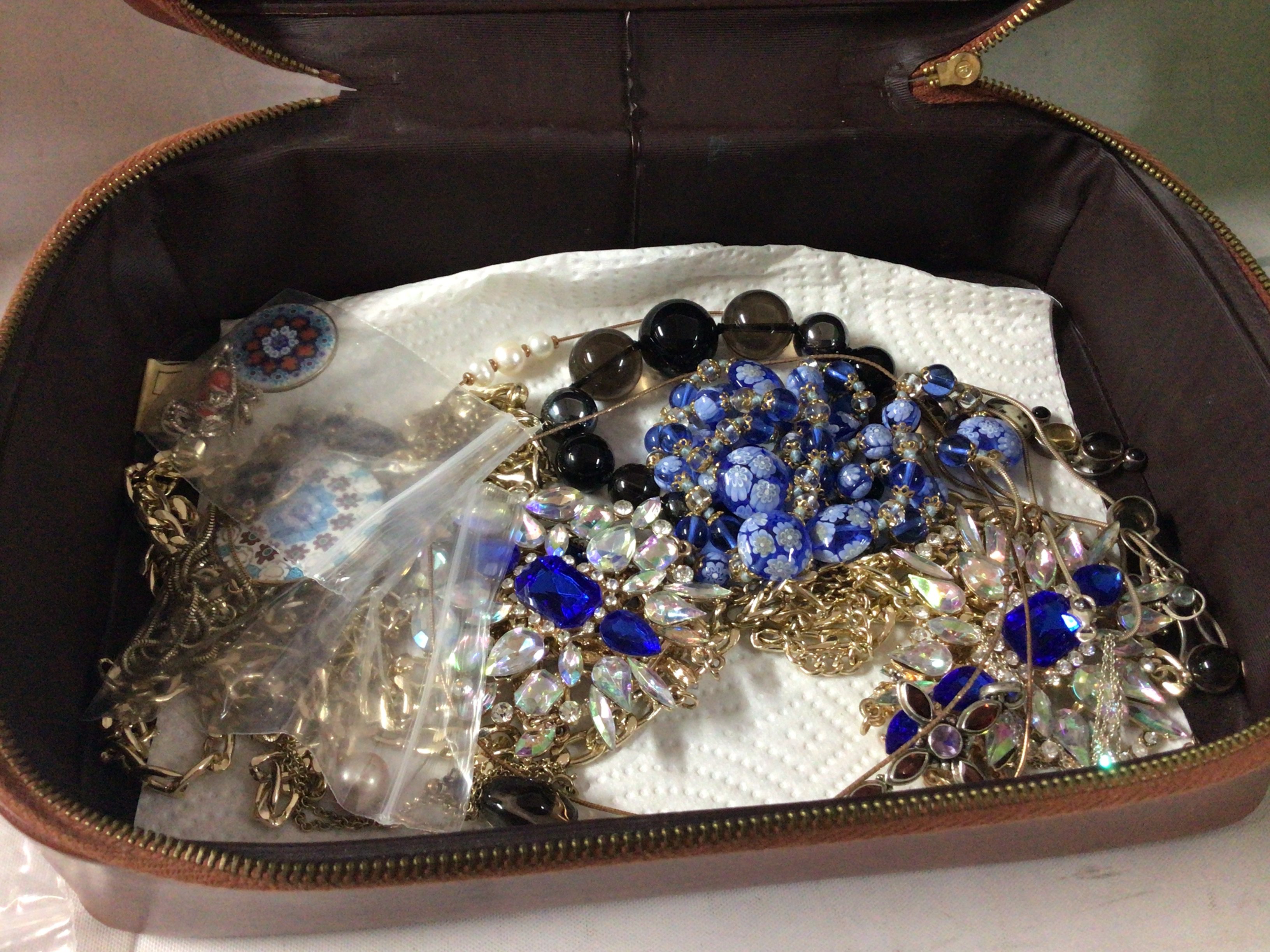 A small collection of costume jewellery in a vintage st micheals box.