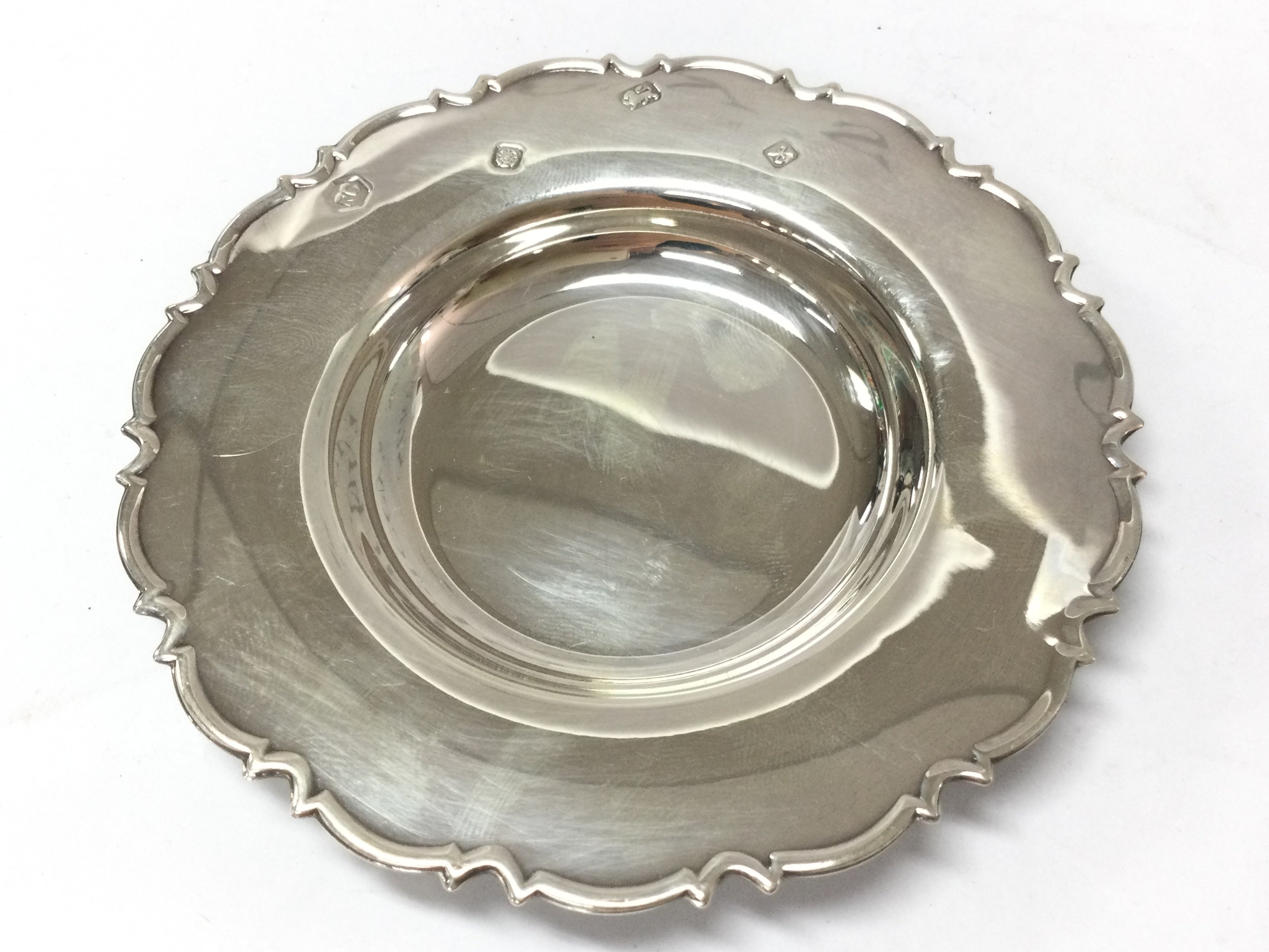 A small silver hallmarked dish. 10cm wide. Postage category A
