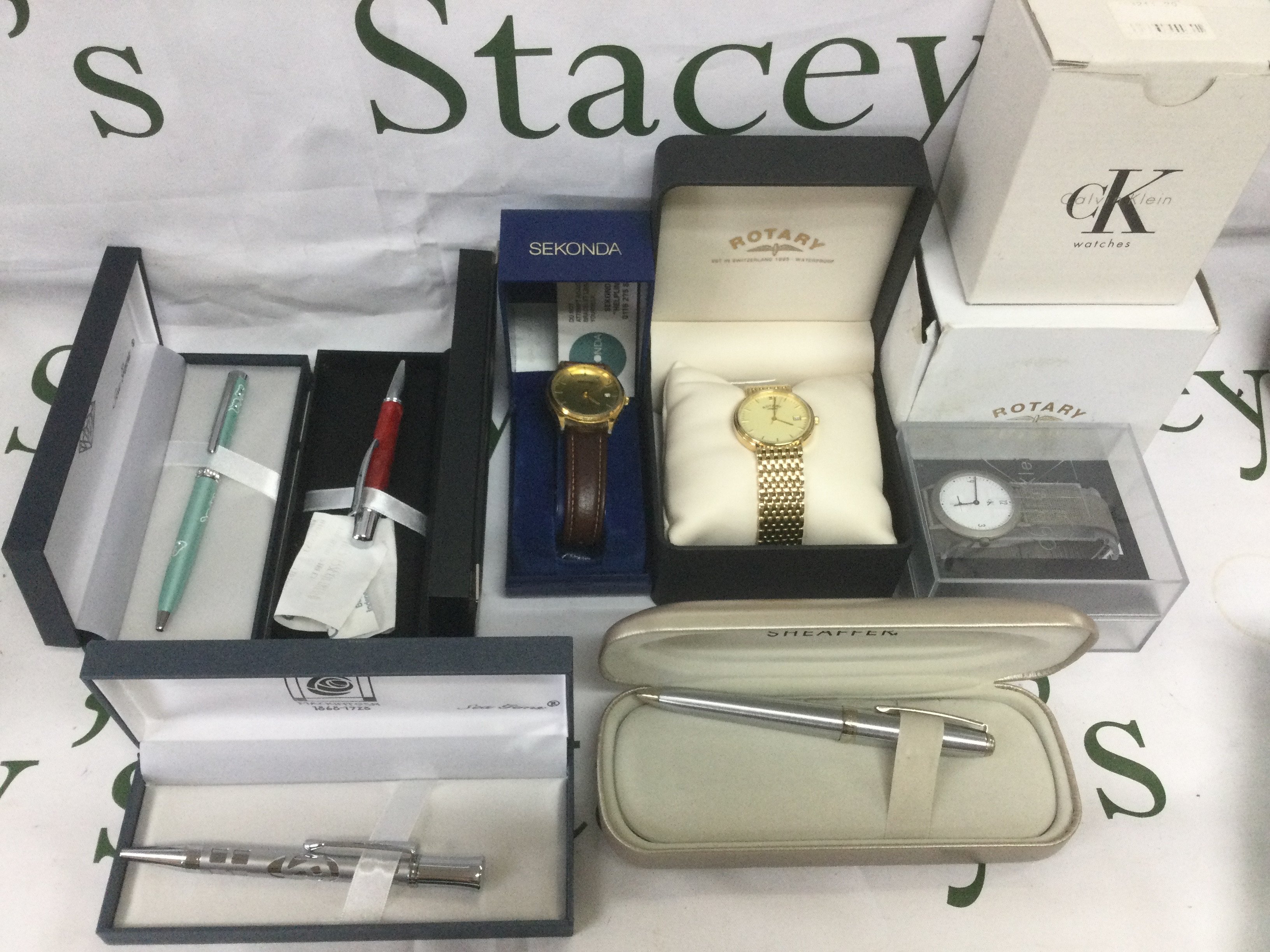 A small collection of pens and watches including boxed Sheaffer pen, boxed Rotary watch etc. Shipping category B.