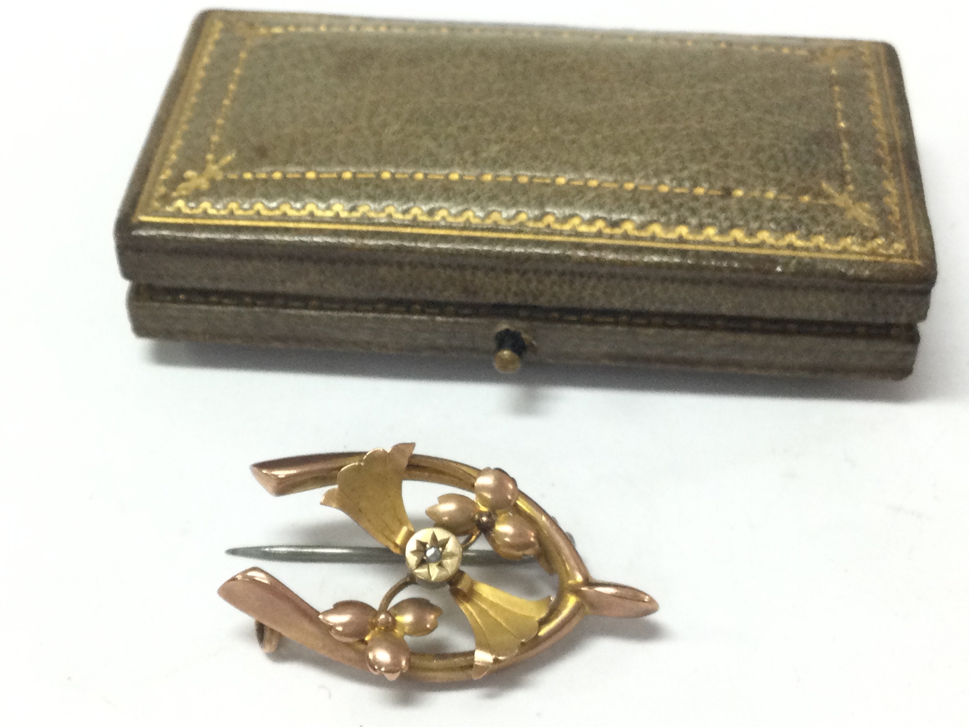 A 9ct gold brooch, 1.9g total weight . Postage catA