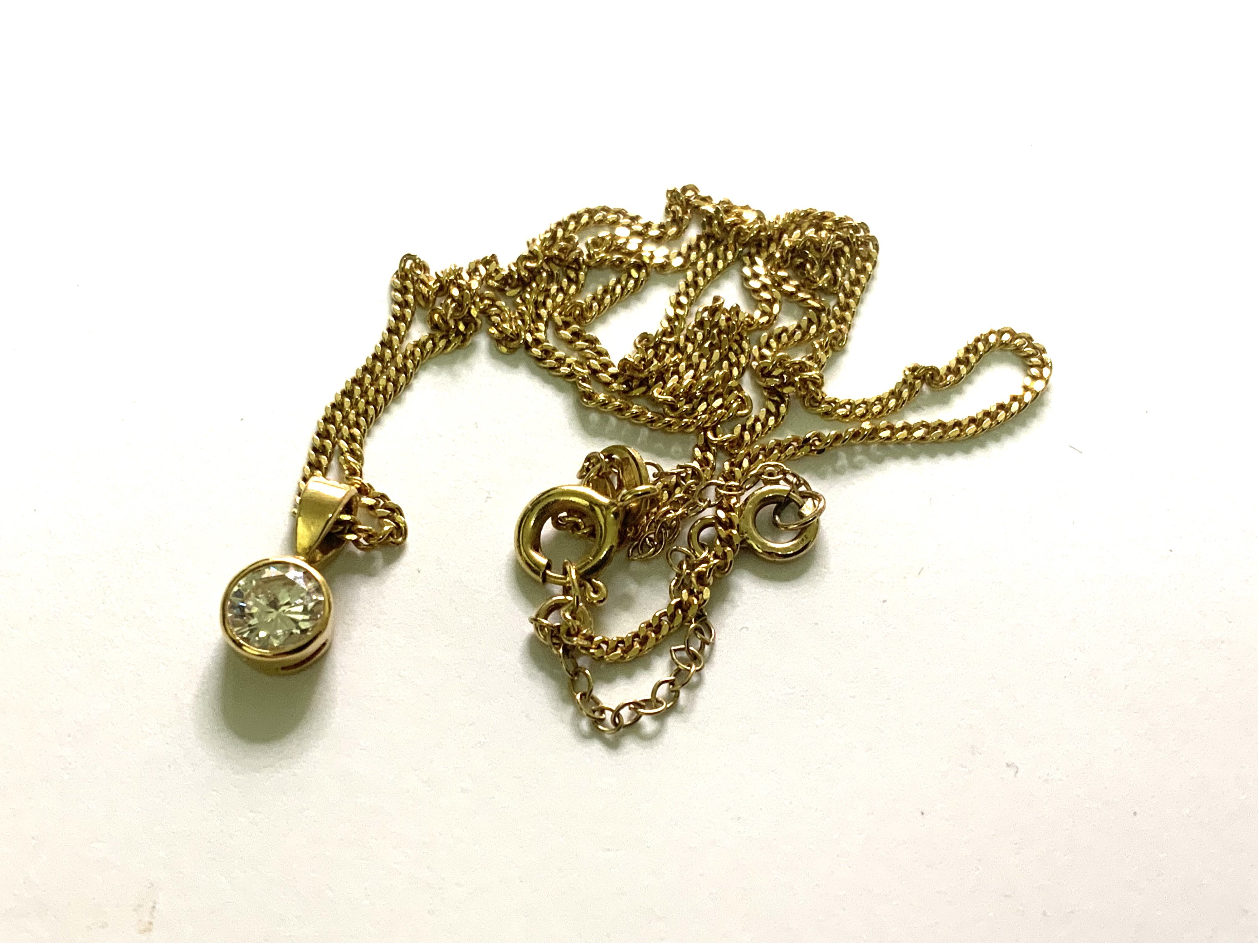 An 18ct yellow gold and 0.75ct solitare diamond pendant and chain. 5.15g. (A)