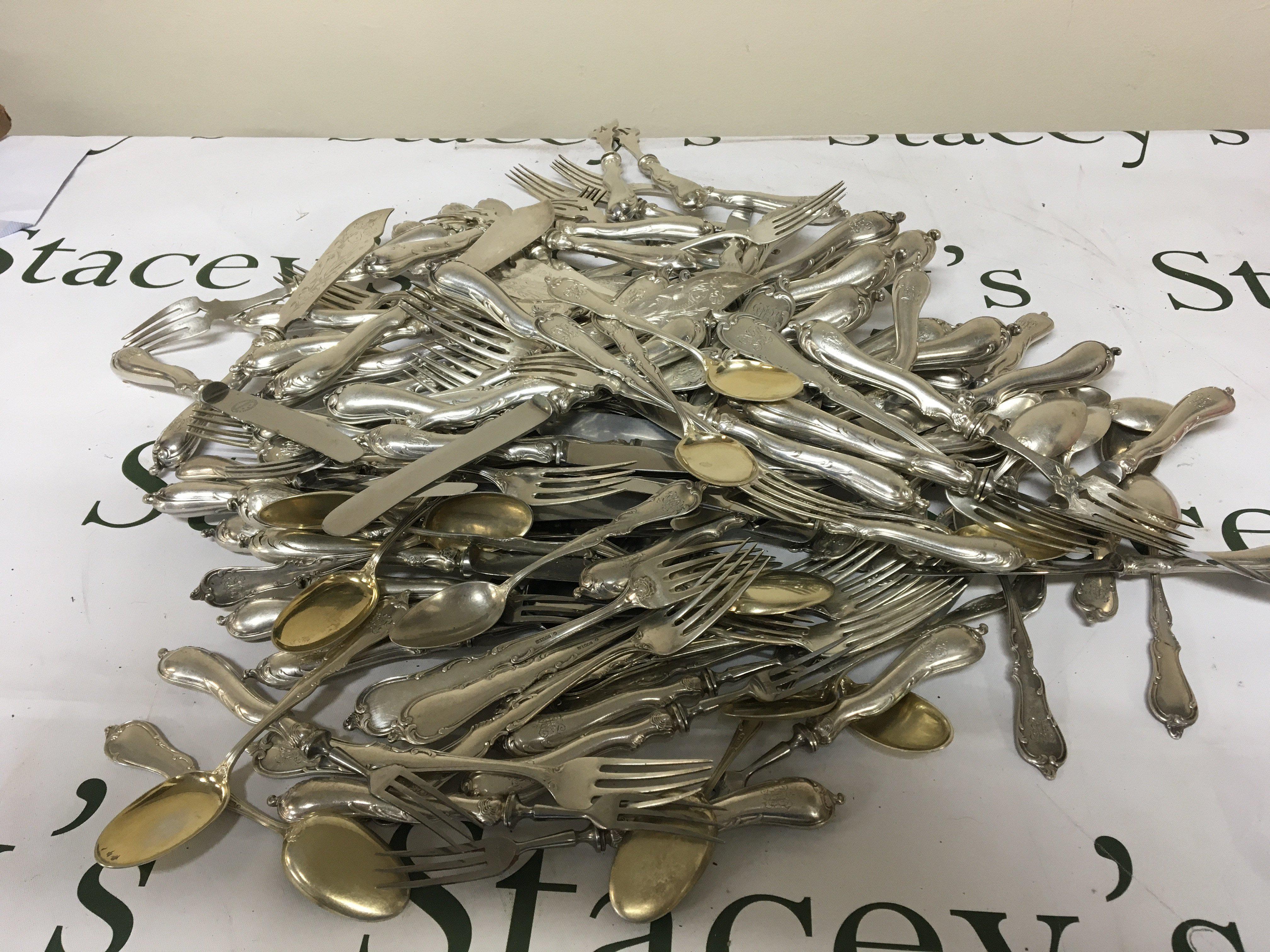 A large quantity of matching collection of German Silver (800) Cutlery loaded silver handled Knifes and folks solid silver folks and spoons total weight inclusive approximately 6.4kg.