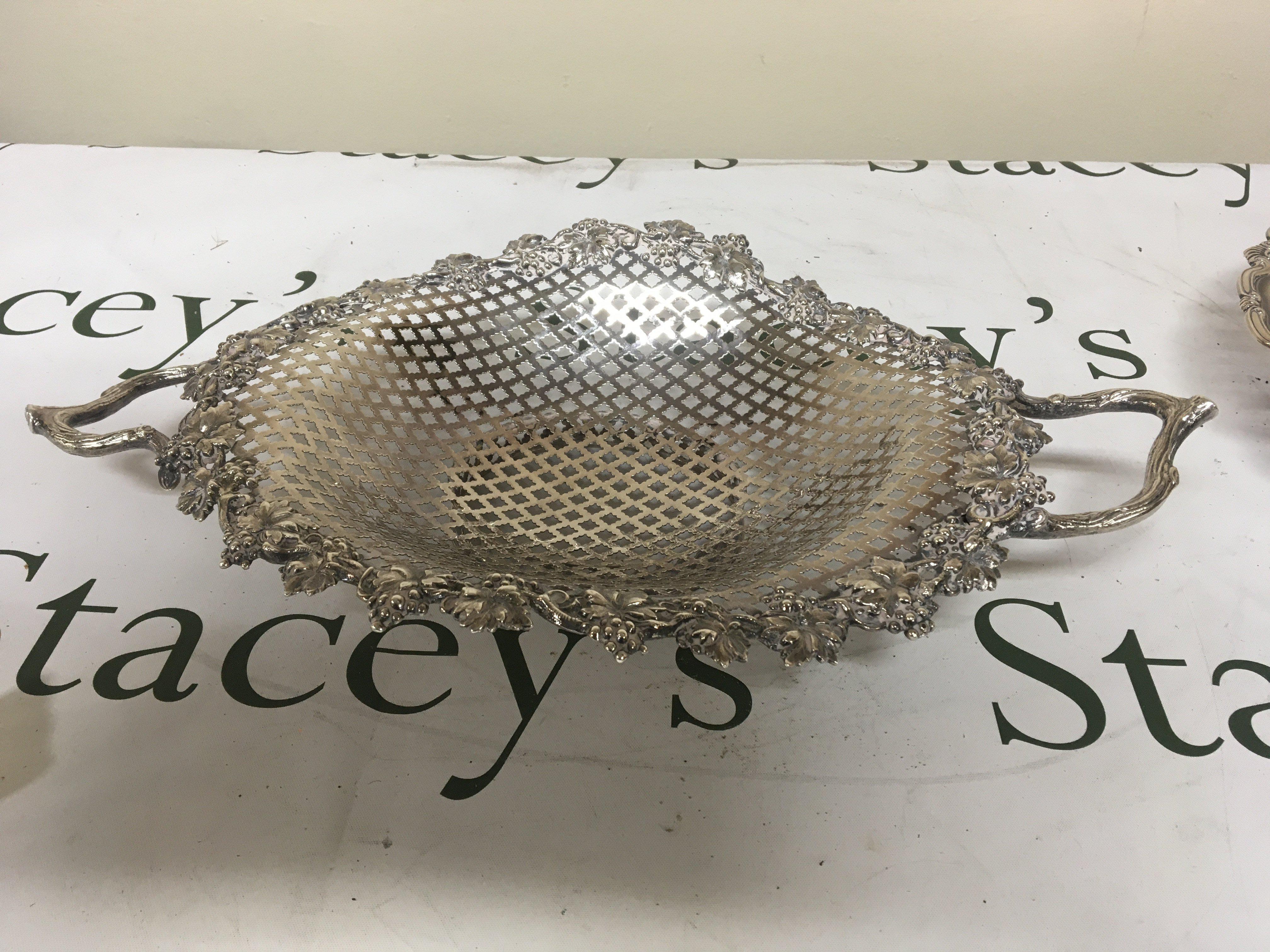A Quality Victorian silver fruit basket with pierced pattern and solid cast naturalistic handles the edge with grape vines Birmingham hallmarks diameter 42cm weight 575g