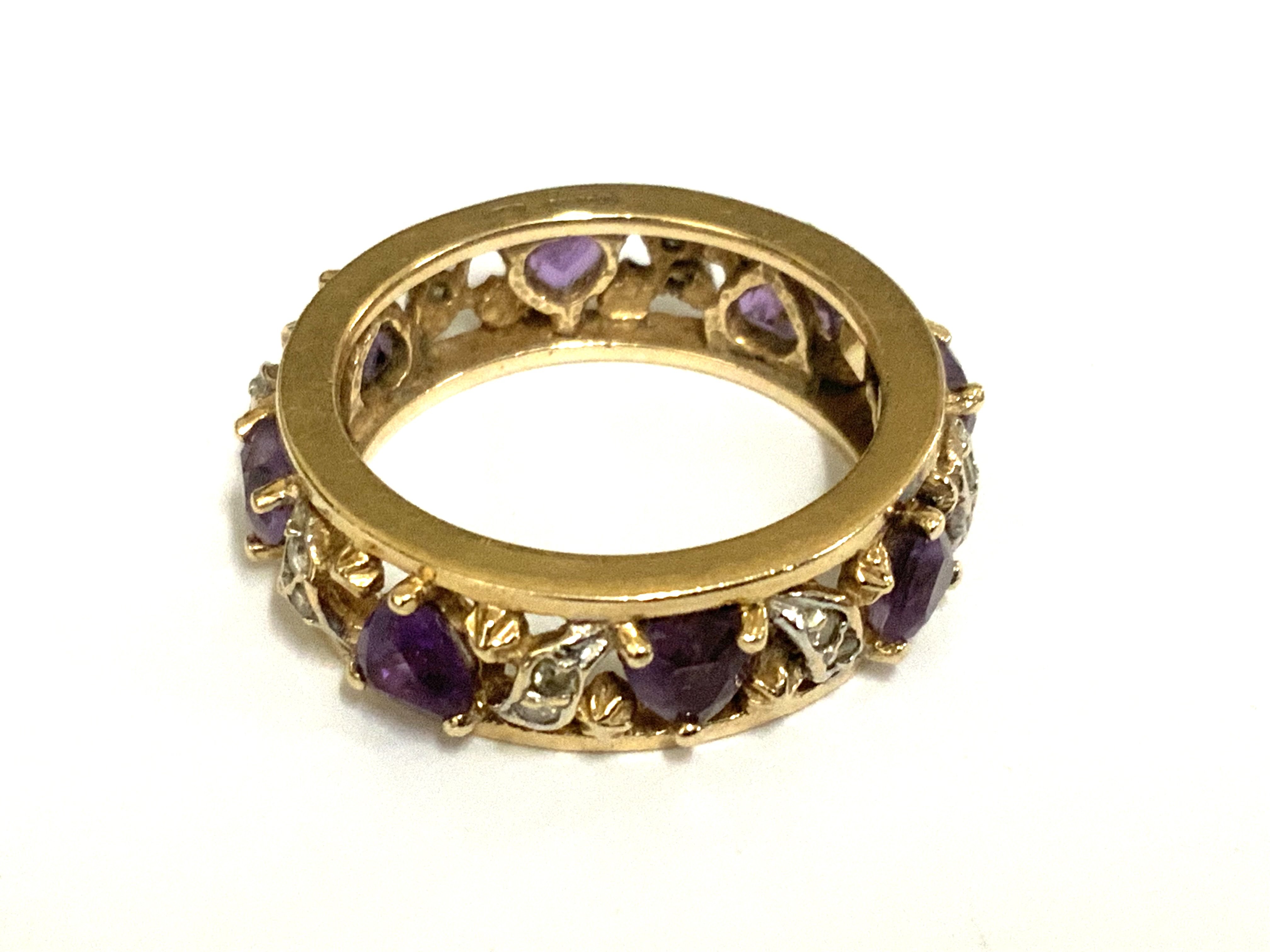 A 14ct gold and heart shaped amethyst and diamond full eternity ring, Size M (A)