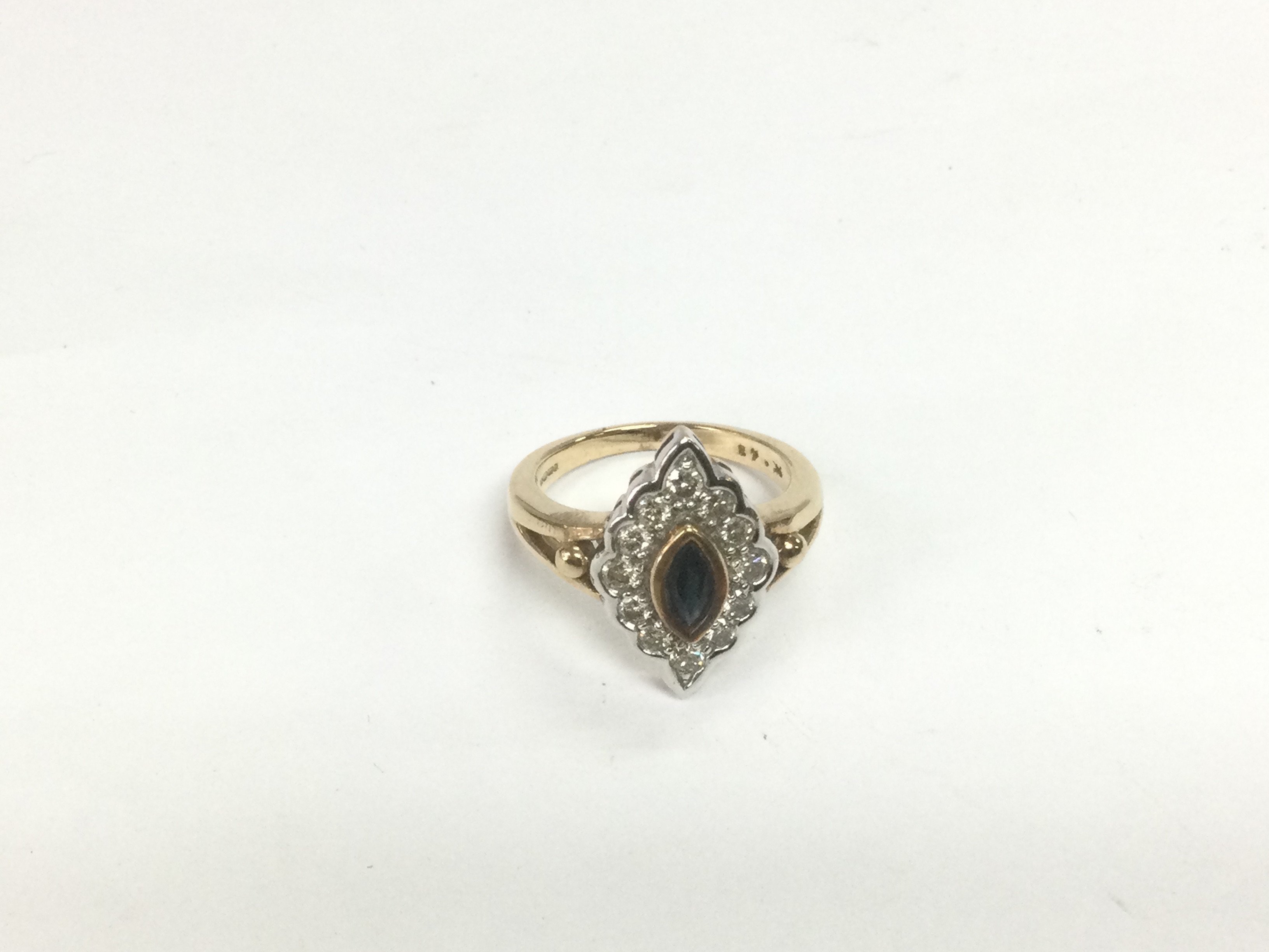 A 9ct gold, diamond and sapphire cluster ring, approx 5g and approx size M. Shipping category A.