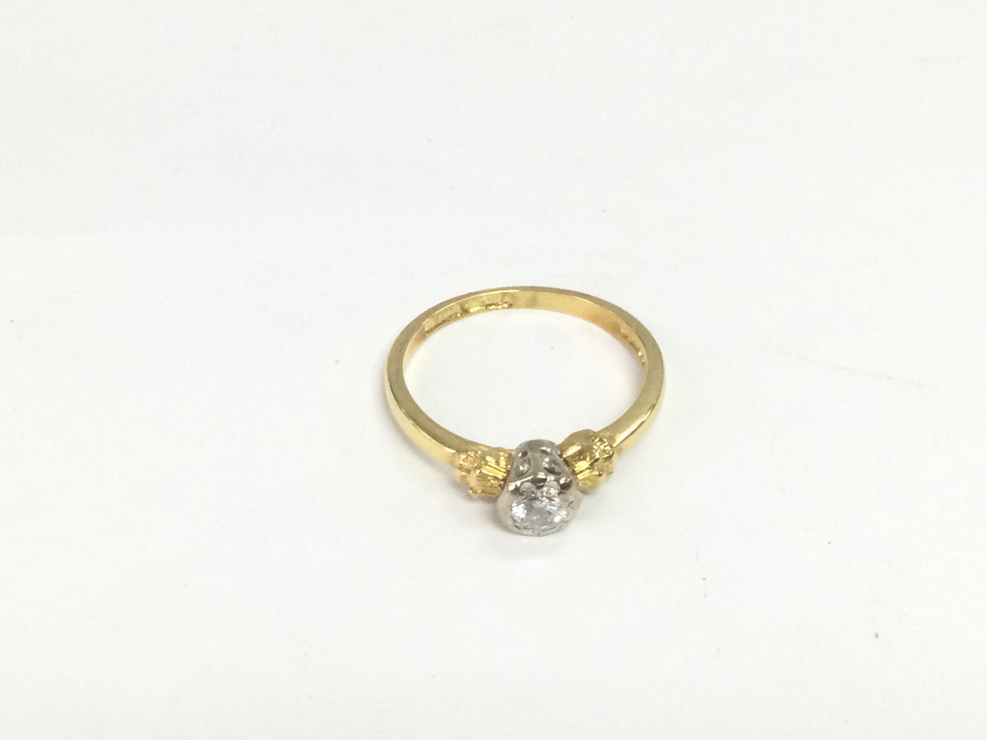 An 18ct gold diamond solitaire ring, approx 2.6g and approx size K. Shipping category A.
