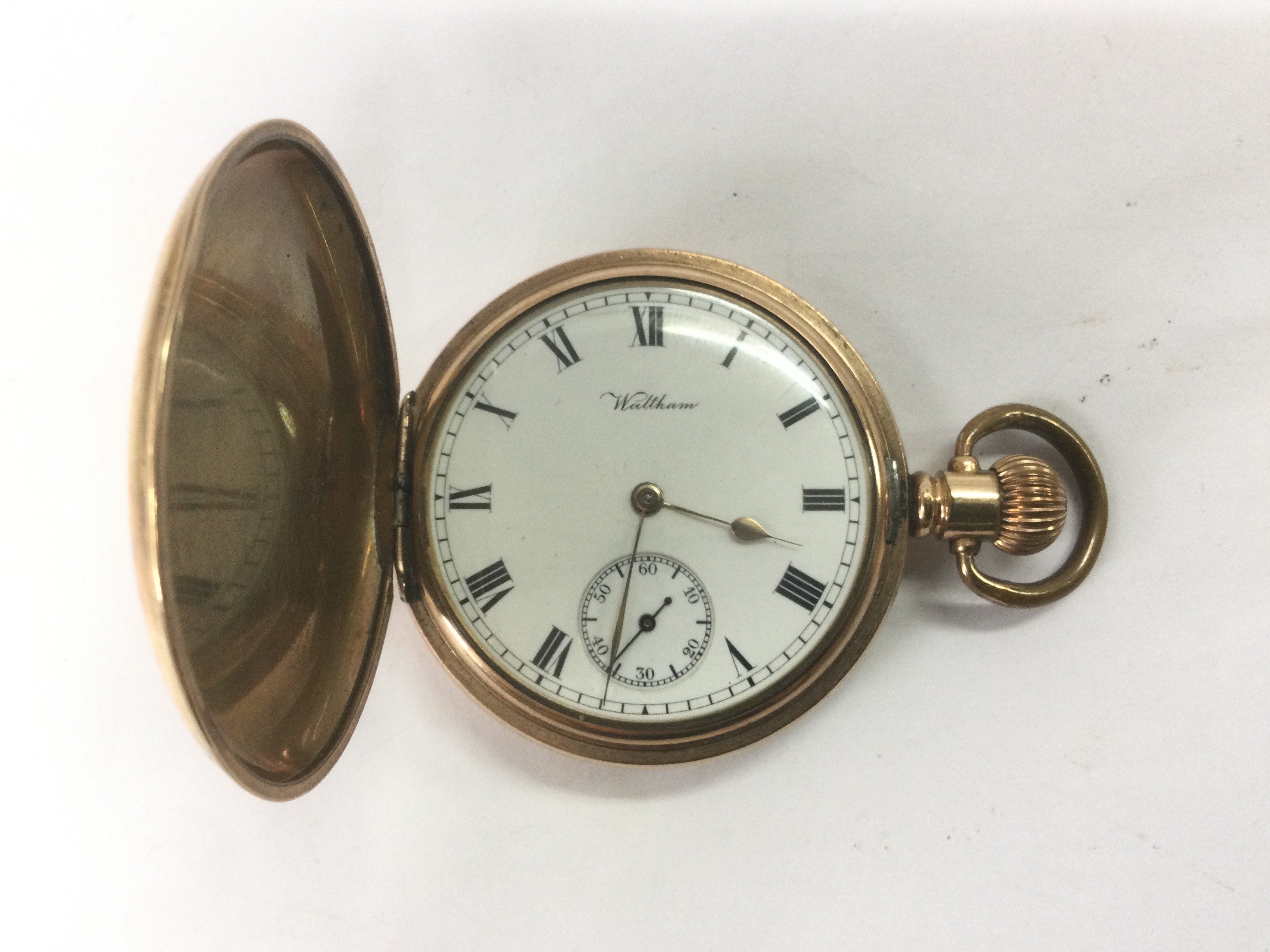 A gold plated Waltham pocket watch. Seen working. Shipping category A.