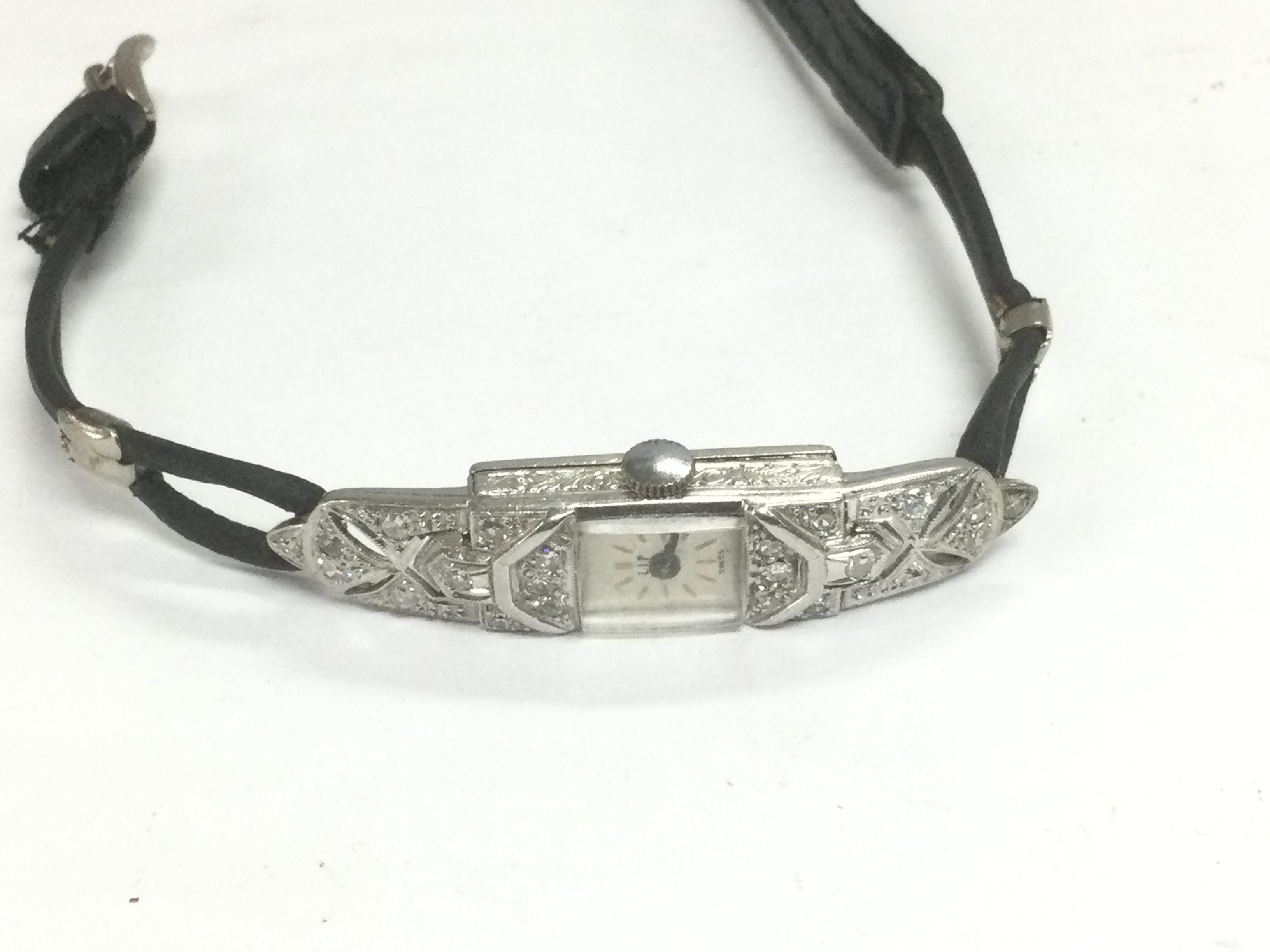 A ladies platinum and diamond set cocktail watch. Shipping category A.