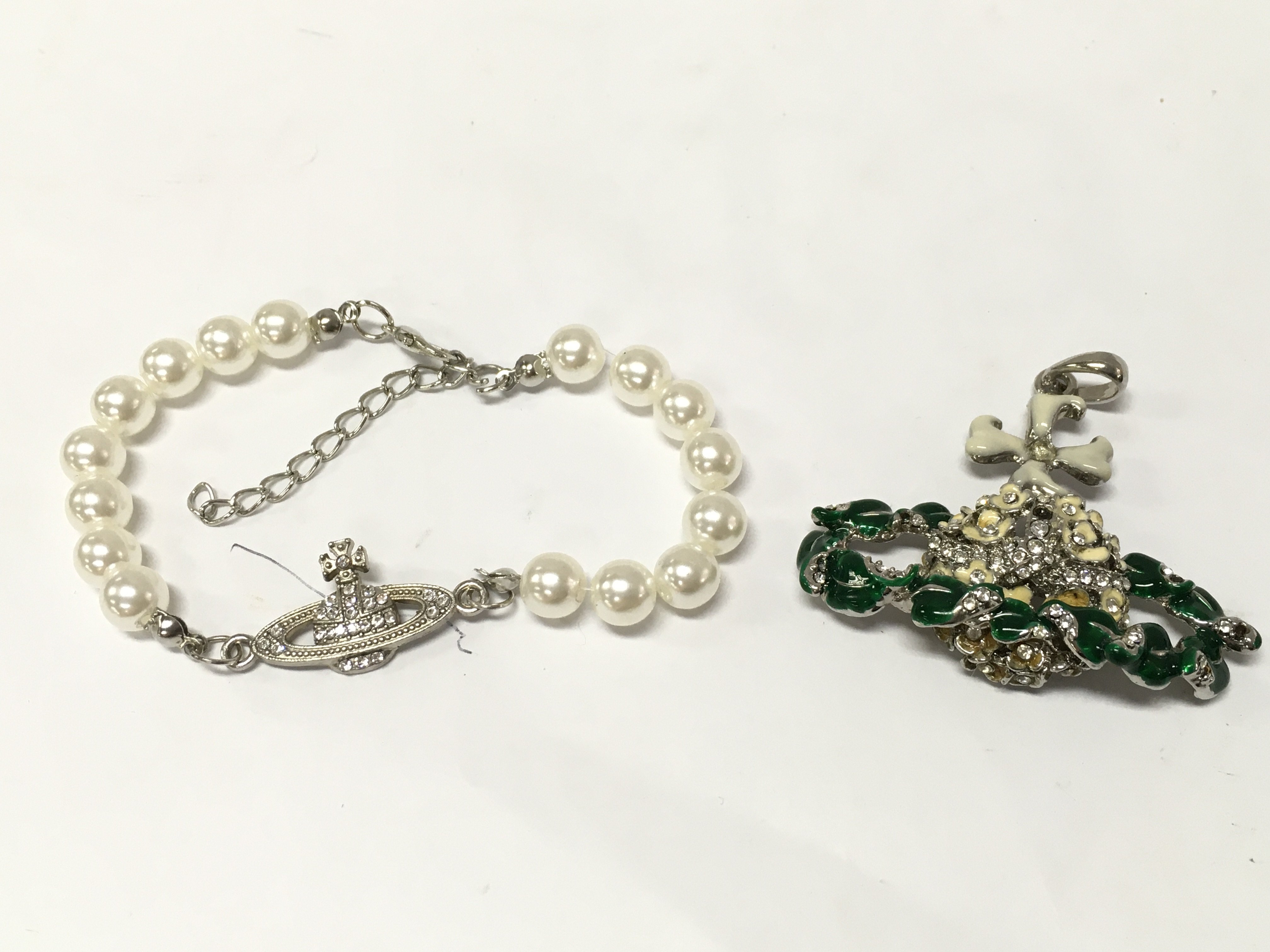 Vivienne Westwood jewellery including a flower orb necklace pendant , postage catA