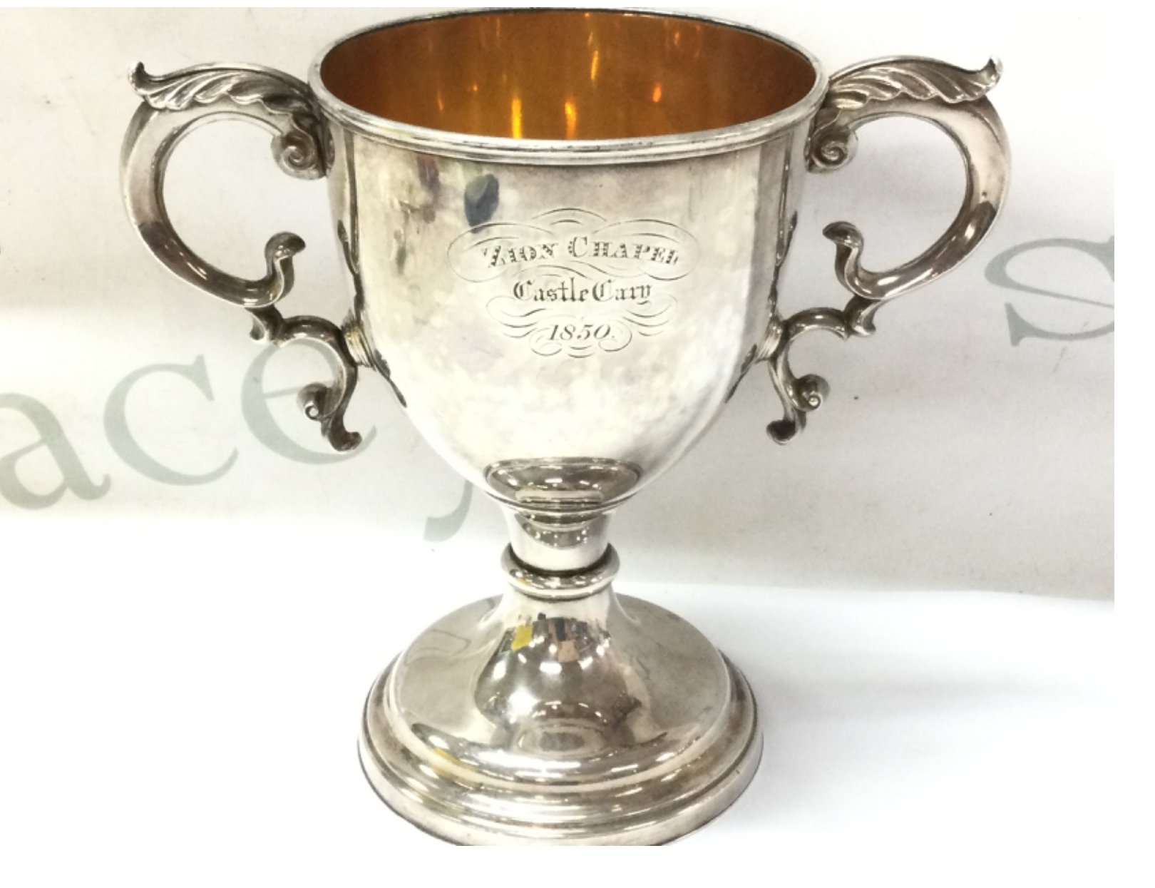 A heavy white metal communion cup dated 1850, approximately 575g. Postage category B