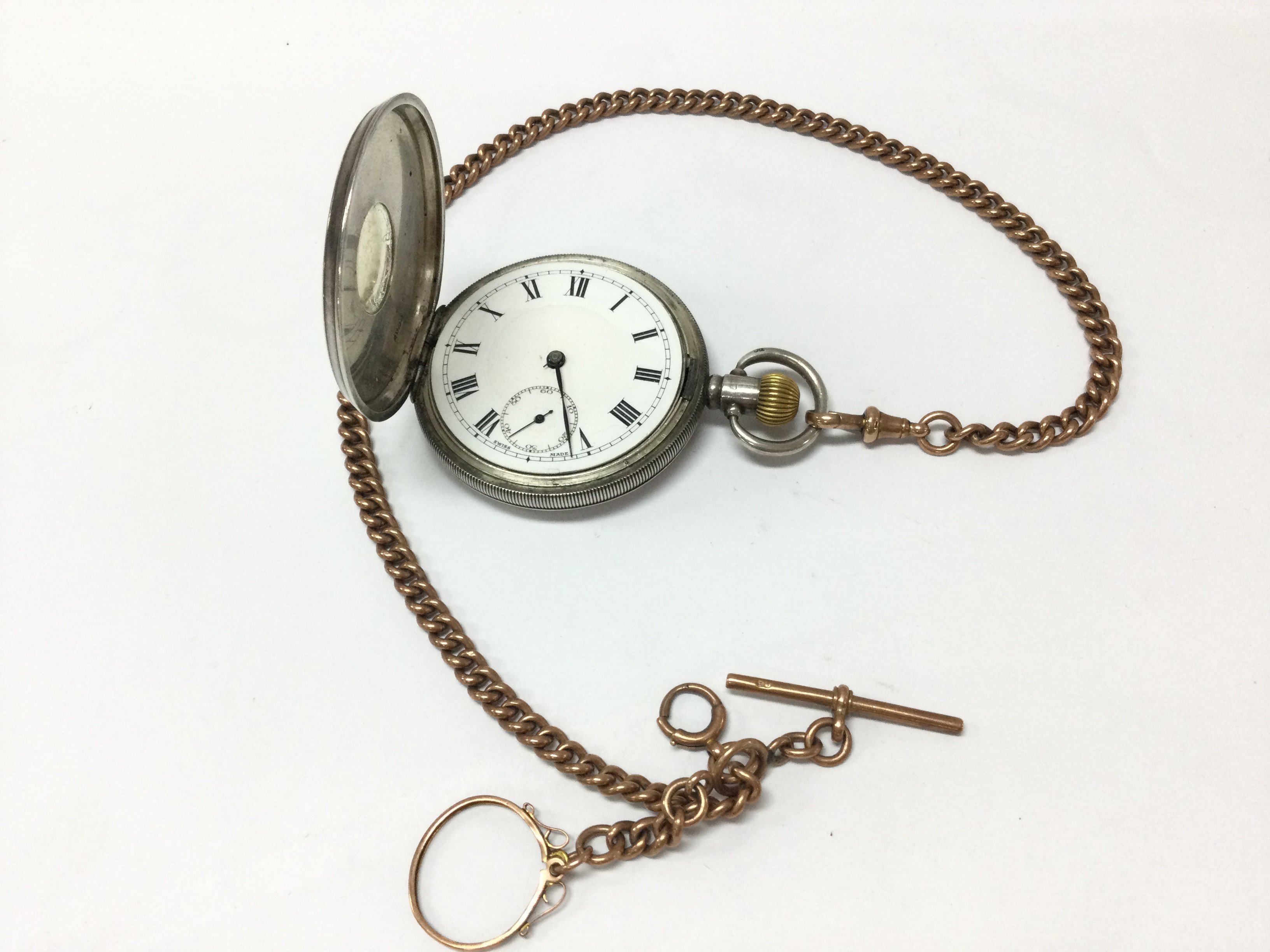A hallmarked silver half hunter pocket watch and an Albert chain . Postage category A