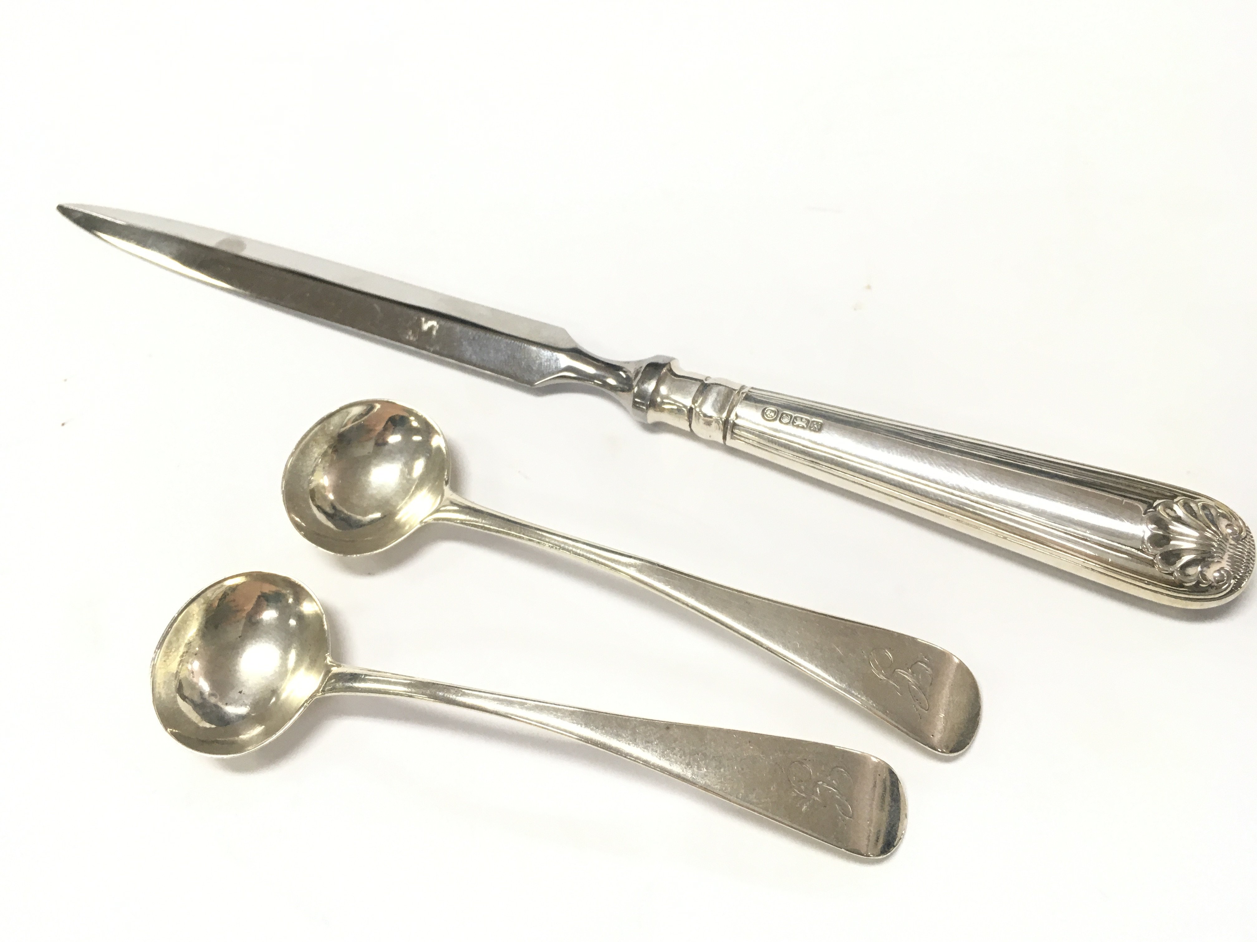 Silver letter opener , two spoons . Postage category A