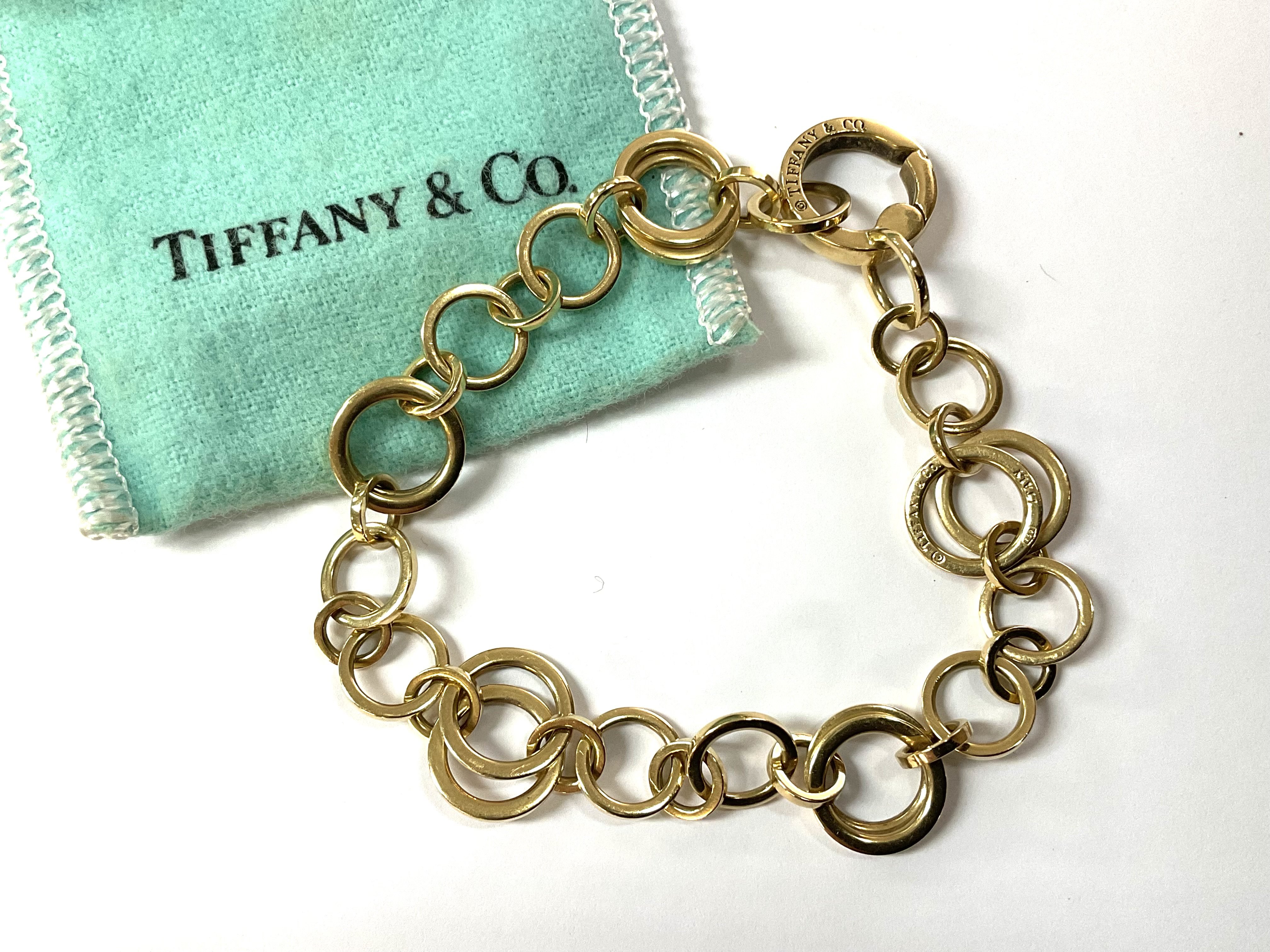 A Genuine Tiffany & Co 18ct yellow gold double hoop bracelet, purchased late 70s.(18cm).