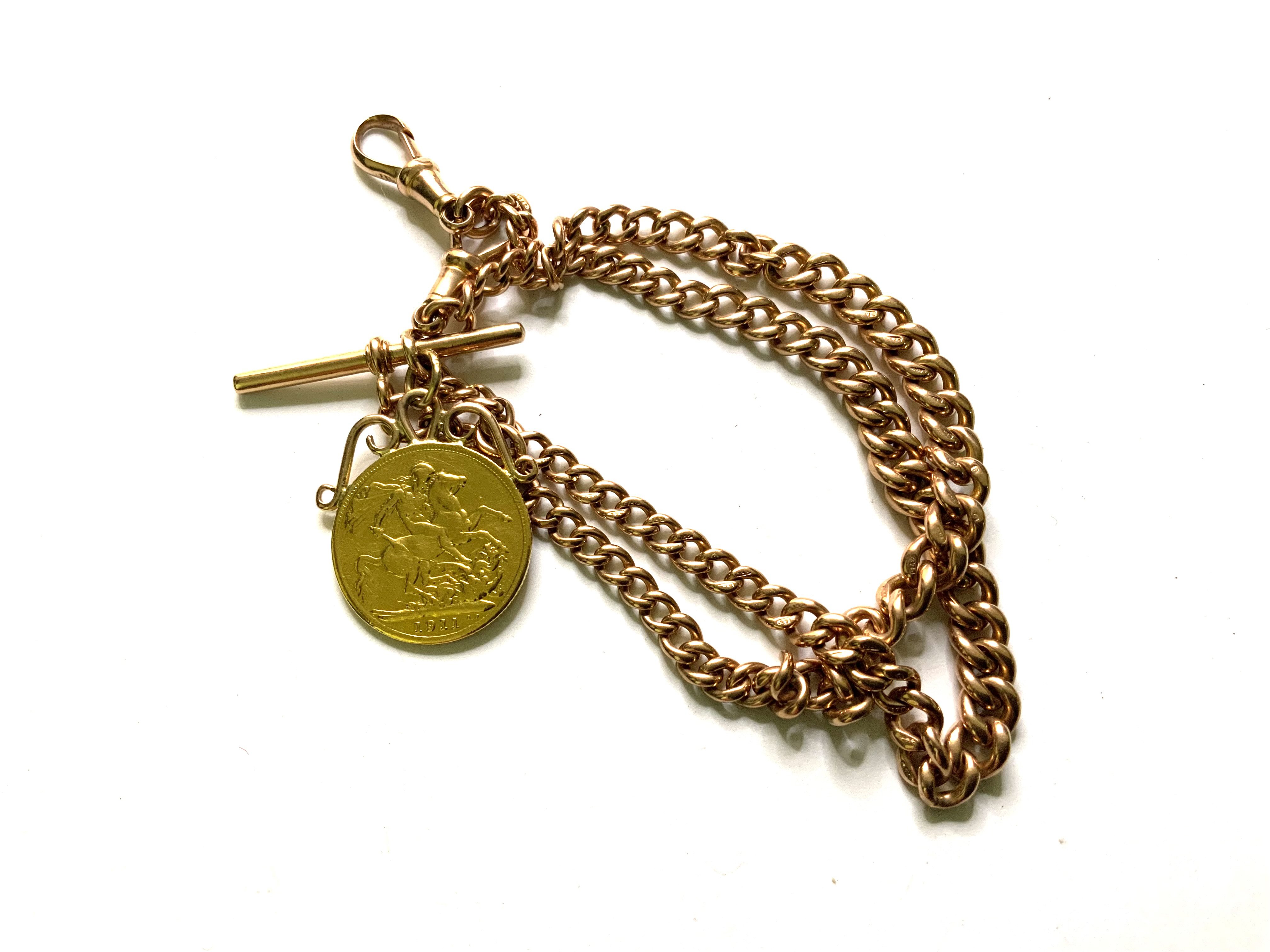 A 9ct Rose gold Albert chain with T-bar, 2 clips, and a 1911 Full sovereign soldered mount. Total weight 40.85g (A)