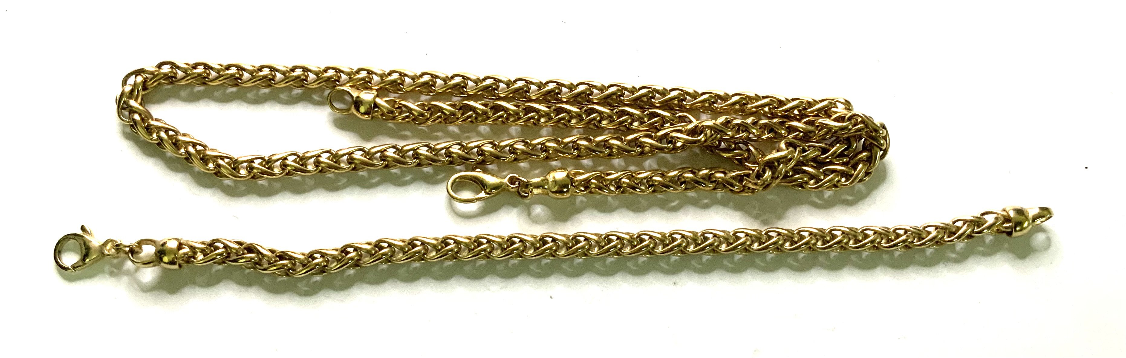 A heavy 9ct gold twist design necklace, 51cm with matching bracelet 19cm (total weight 62.4g). (A)