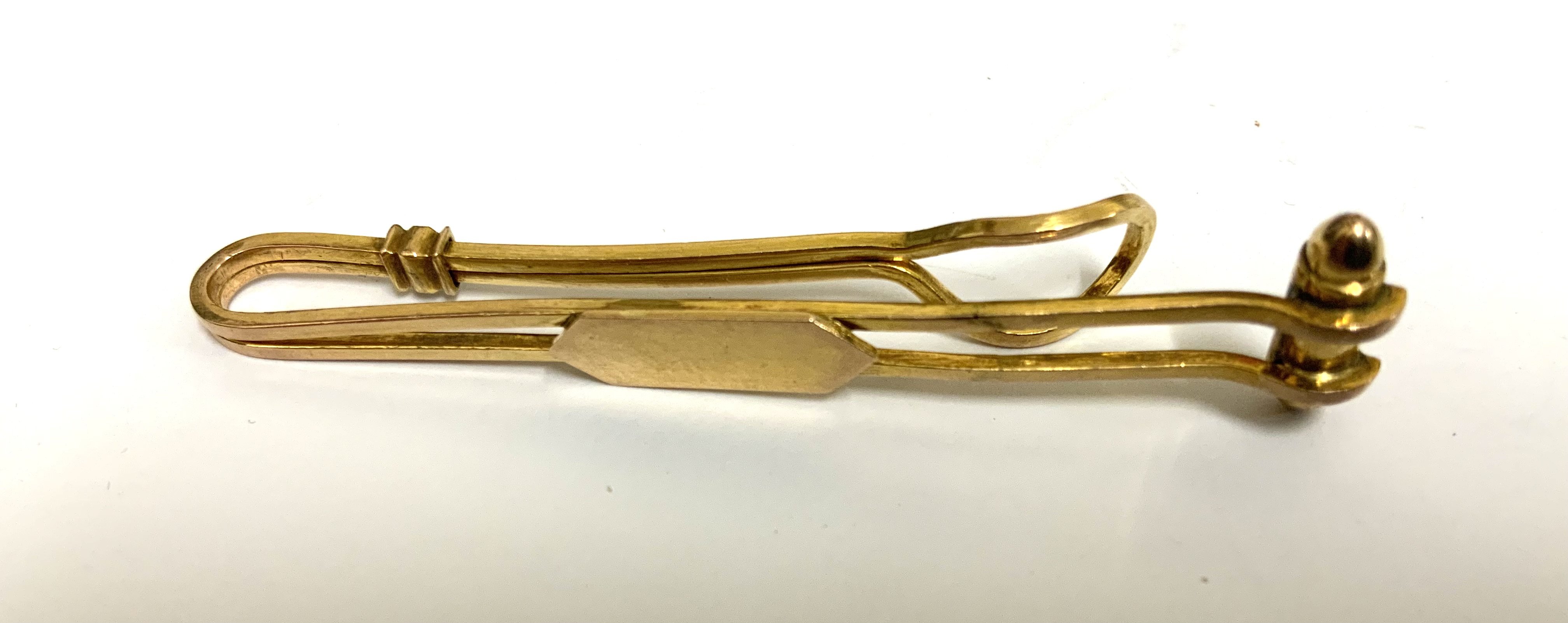 An 18ct gold money clip. 6.17g (A)