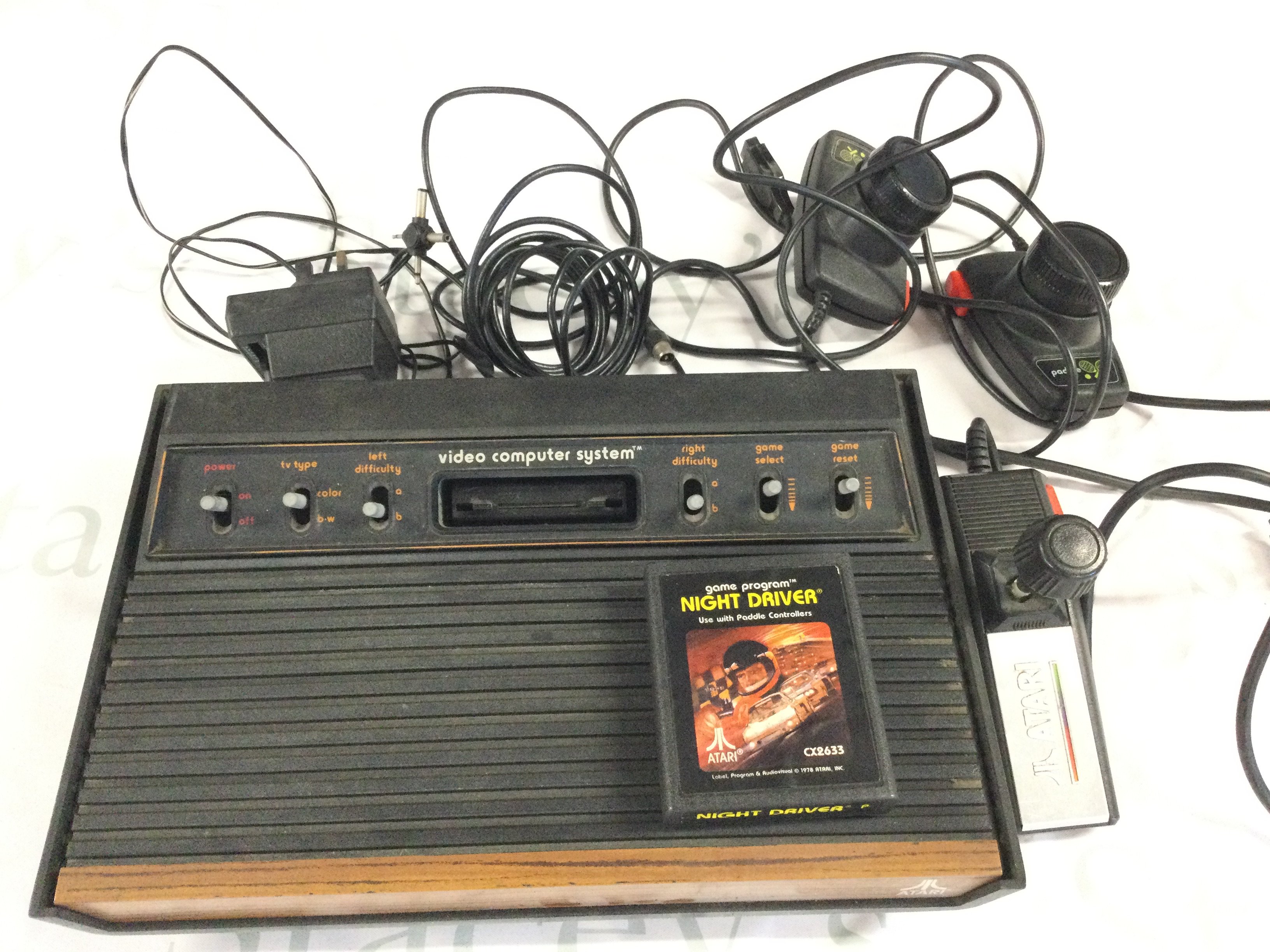A Atari Video Computer system with Game Night Driver. No Reserve.