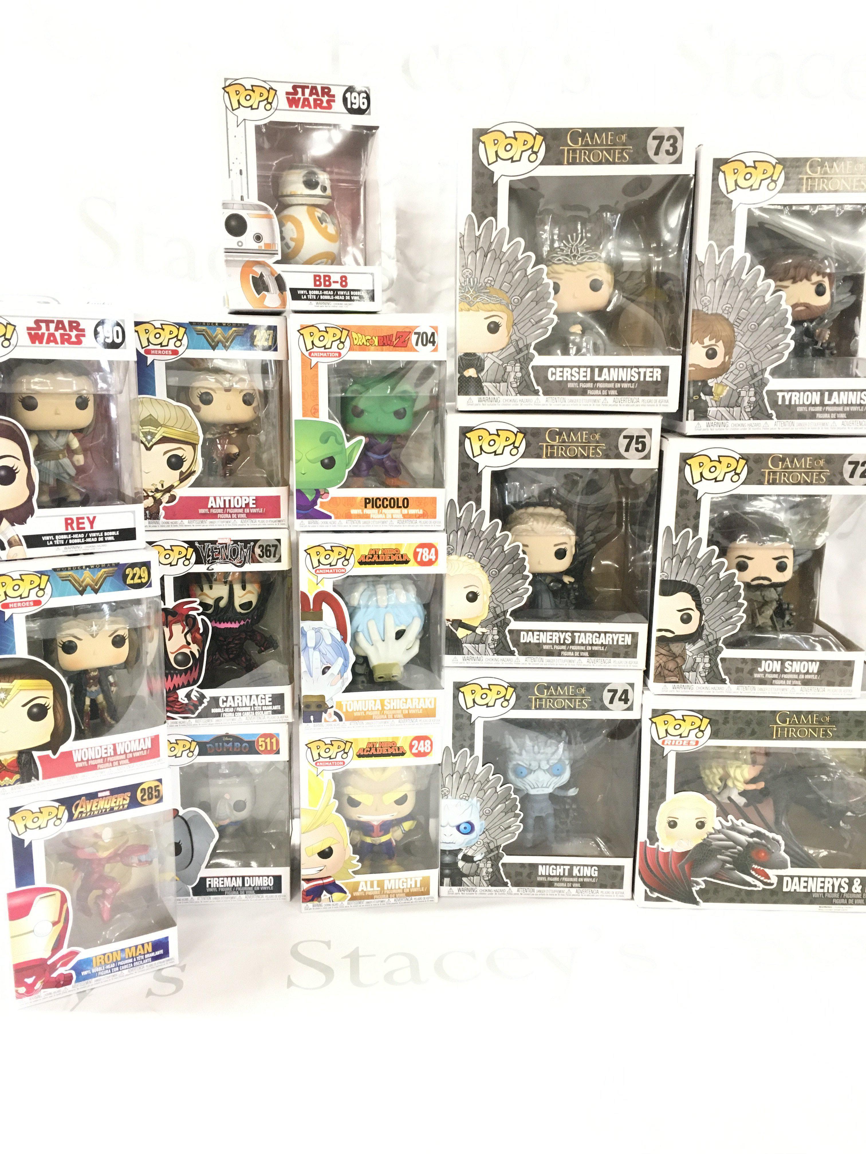 A Collection of Boxed Funko Pop Figures Including Game Of Thrones.
