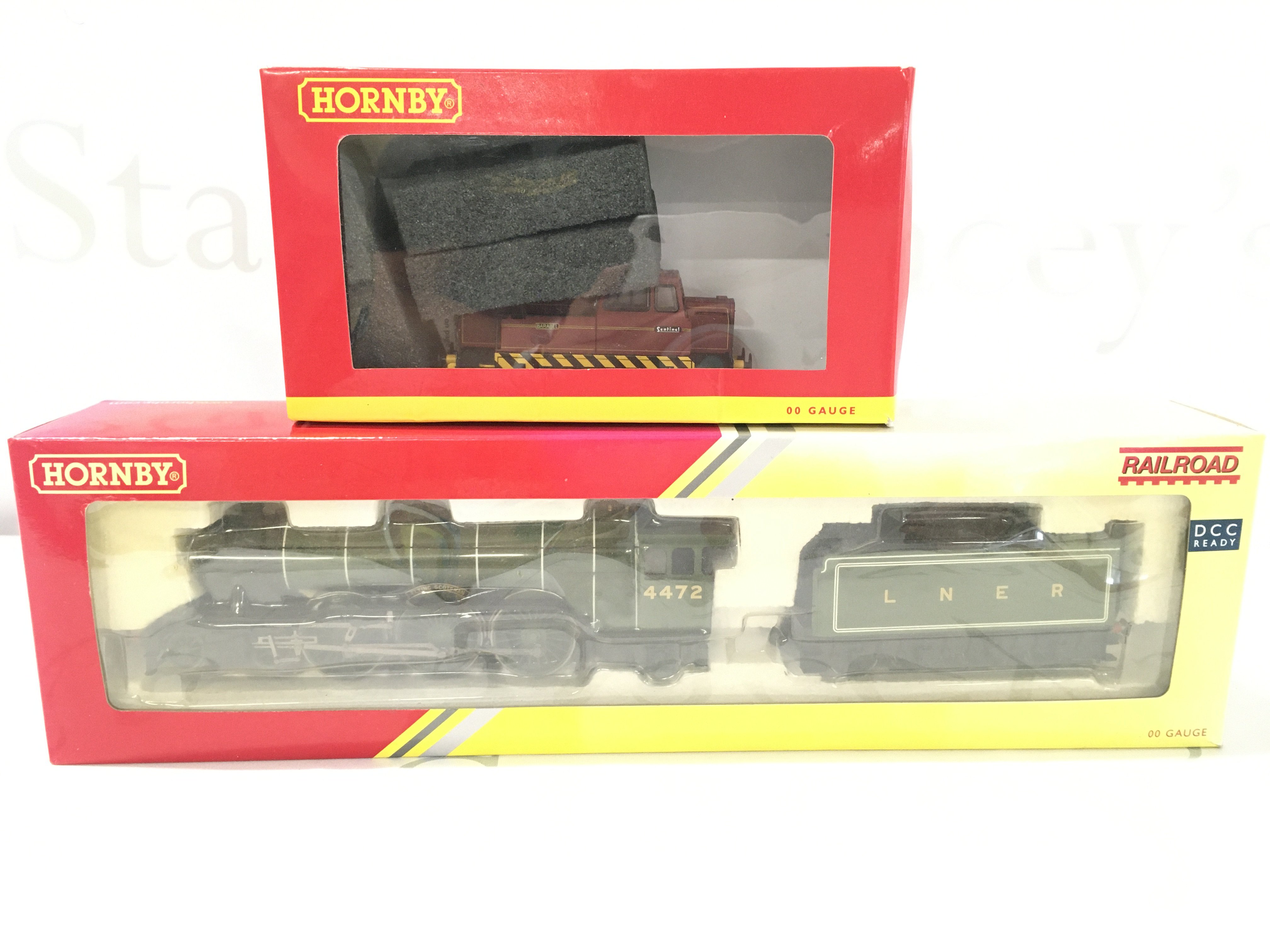A Boxed Hornby 00 Gauge Flying Scotsman LNER Class AI #R3086 and a 0-4-0 Diesel Barabel #RR3354.