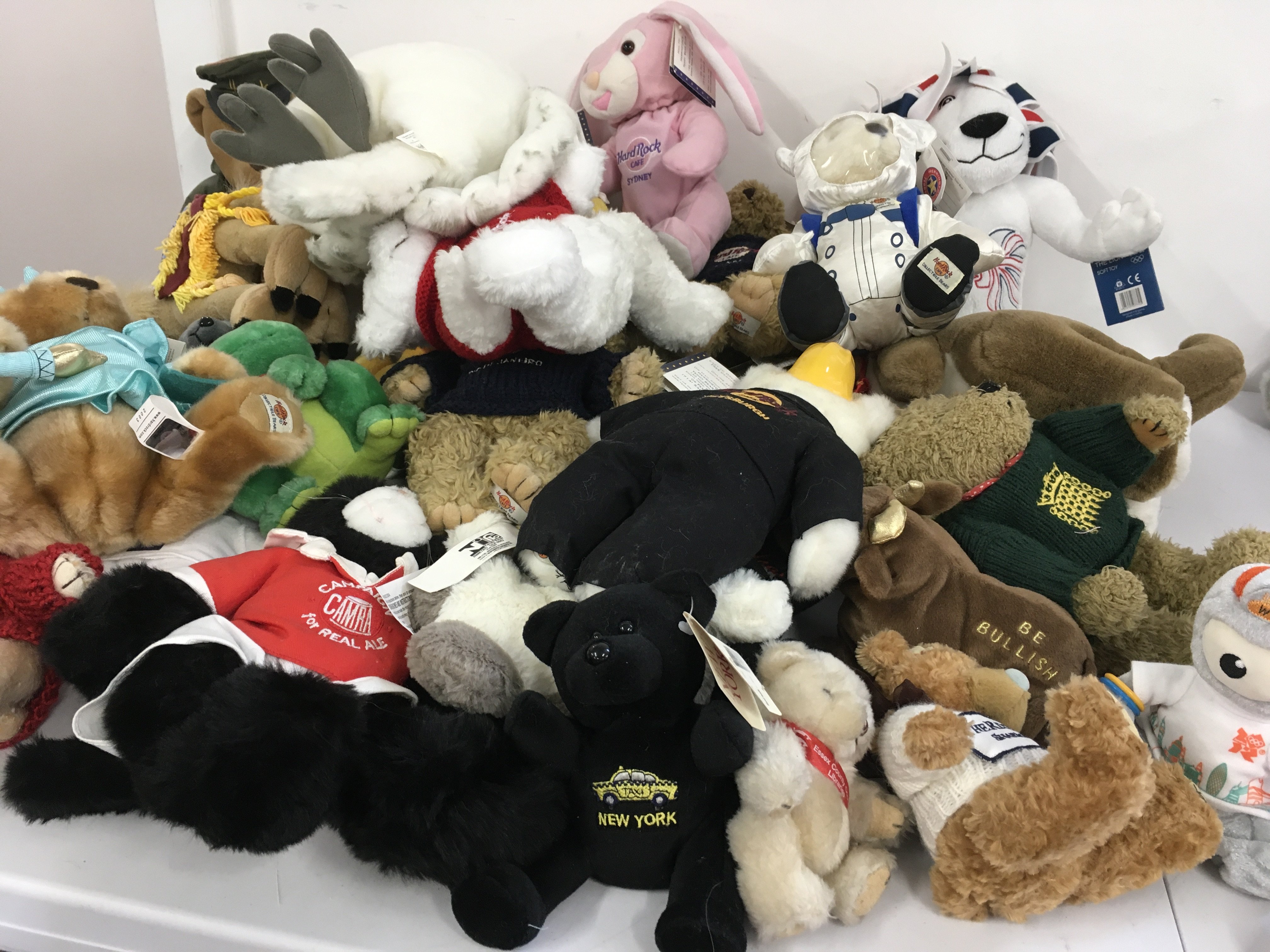 A large collection of teddy bears Hard Rock Cafe with tags but also includes other bears such as Harrods etc. no reserve.