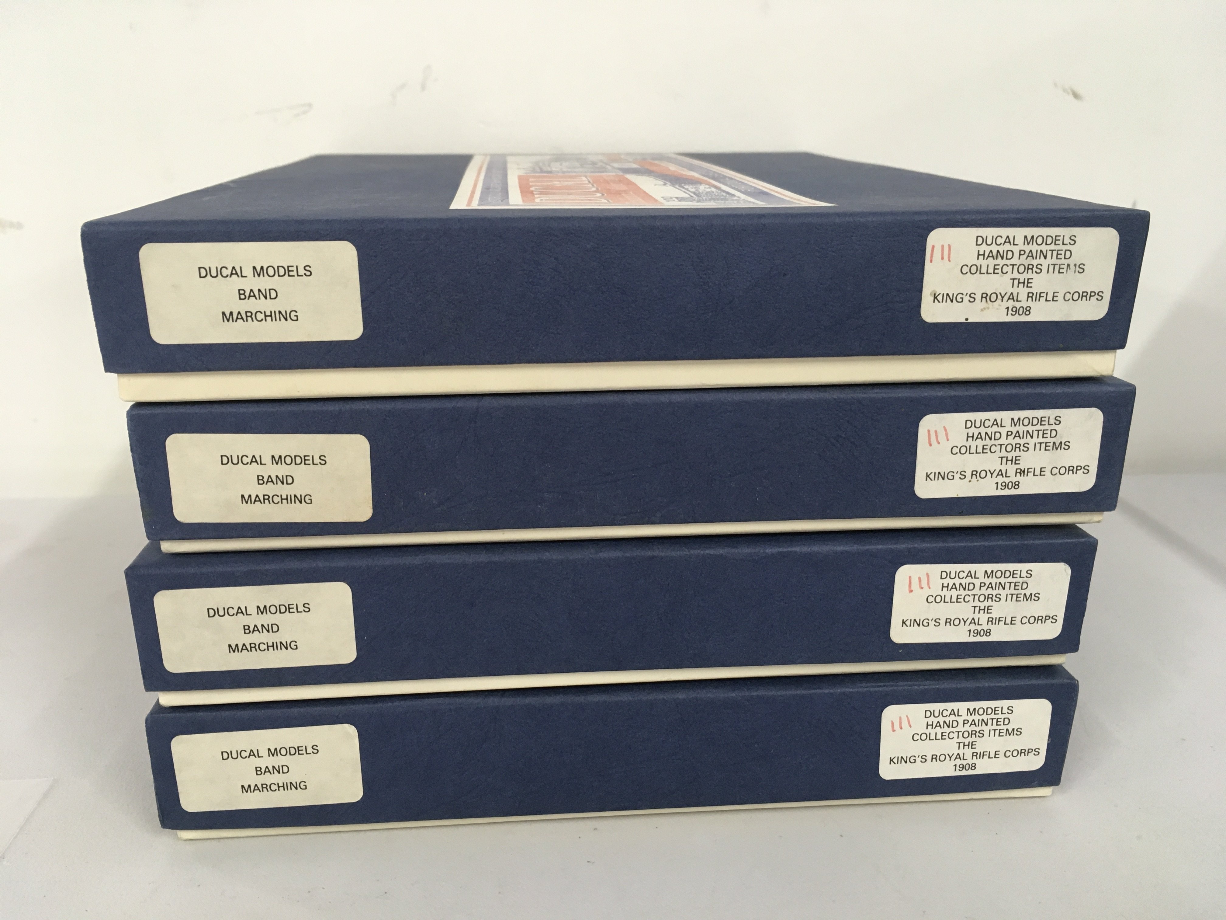 4 boxed Ducal metal military Minature figure sets features the marching band of The Kings Royal Rifle Corps 1908. No reserve