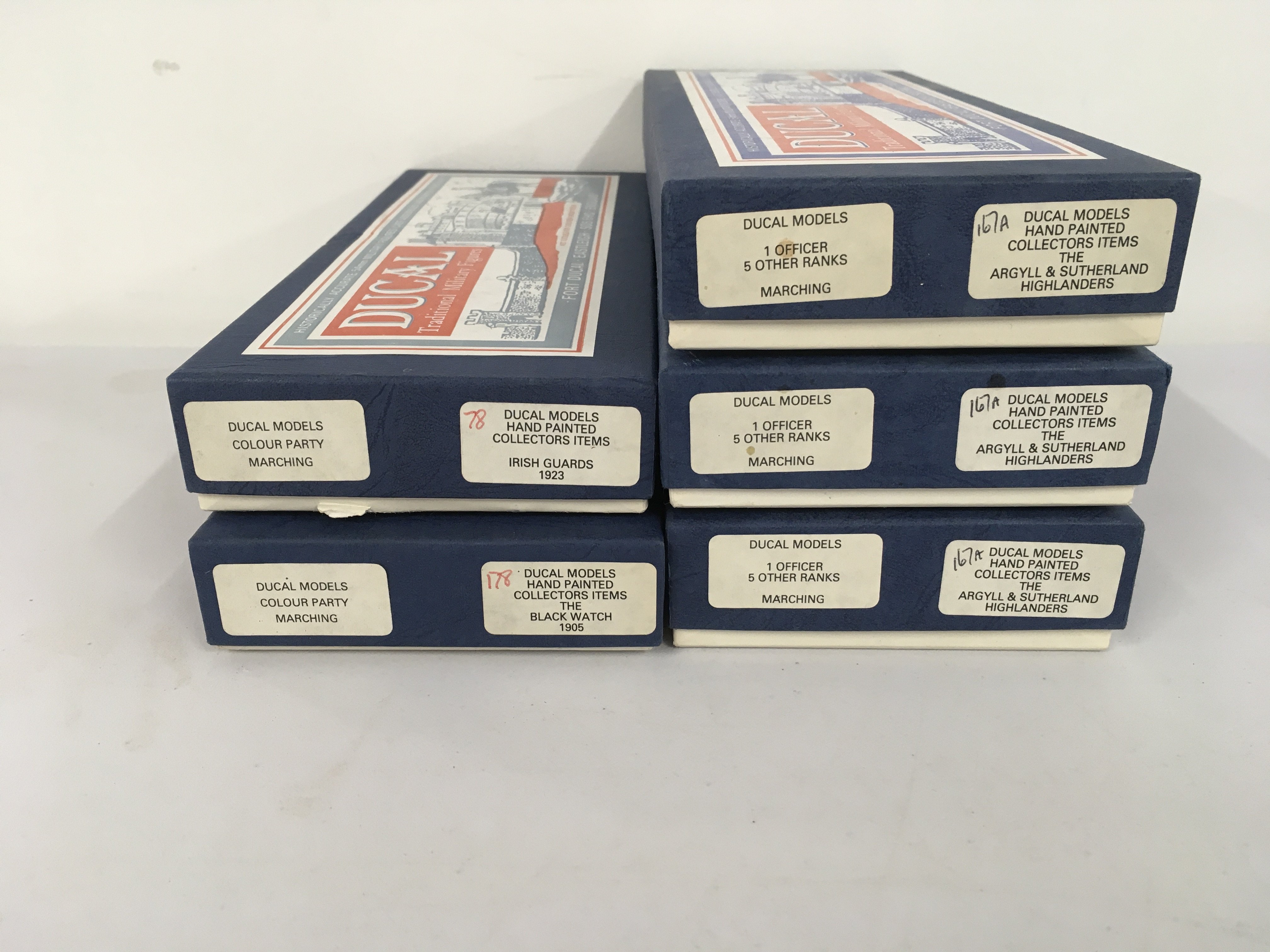 5x boxed sets of Ducal metal military Minature figures featuring 3 sets The Argyll and Sutherland Highlanders officers and ranks marching. Also featuring Colour Party Marching for Irish Guards 1923 and The Black Watch 1905. No reserve