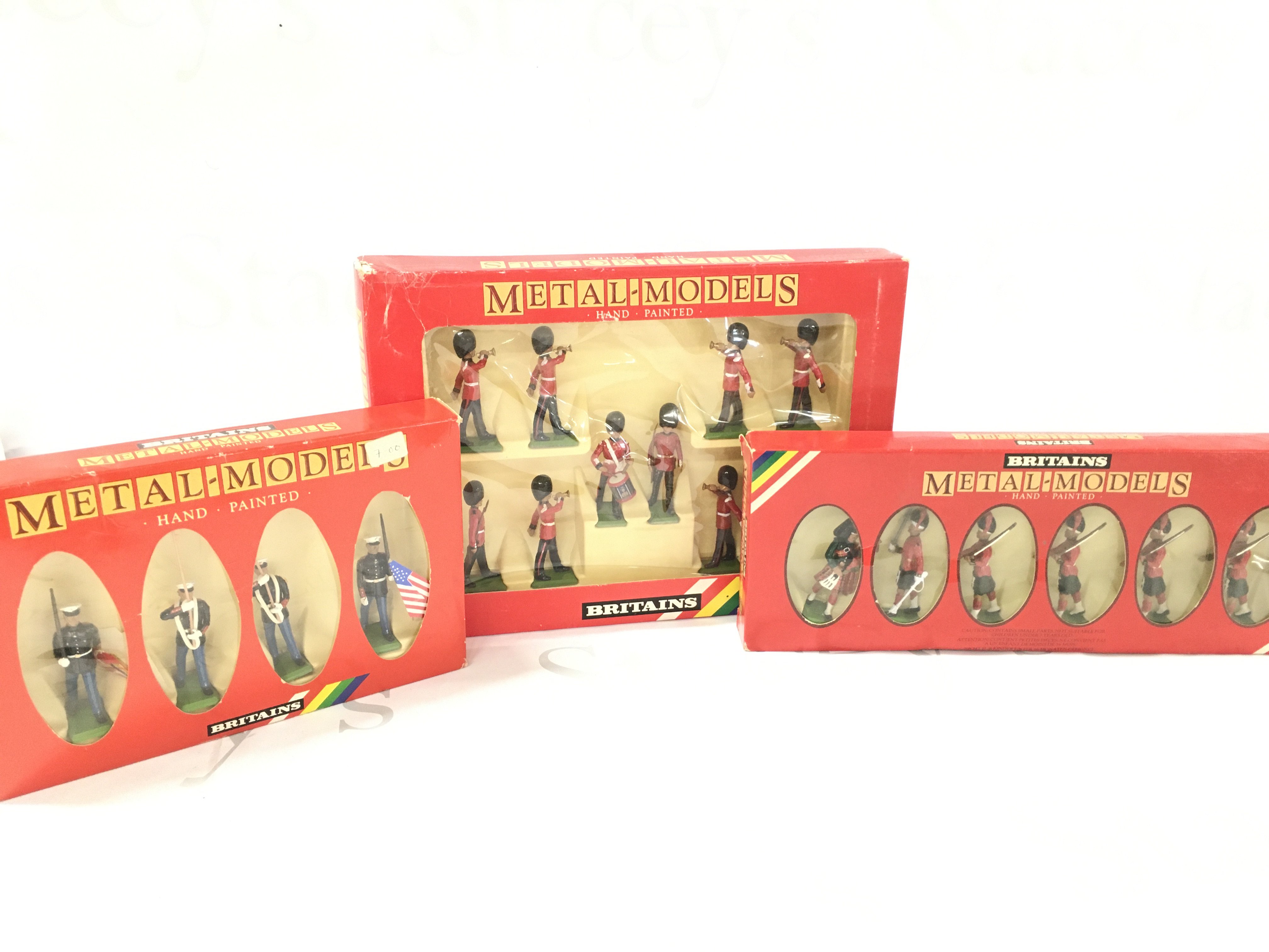 3 X Boxed Britains. U.S. Marine Corps #7301. Scots Guards Colour Party #7207 And Black Watch Officer Piper And 4 Men #7237. No Reserve.
