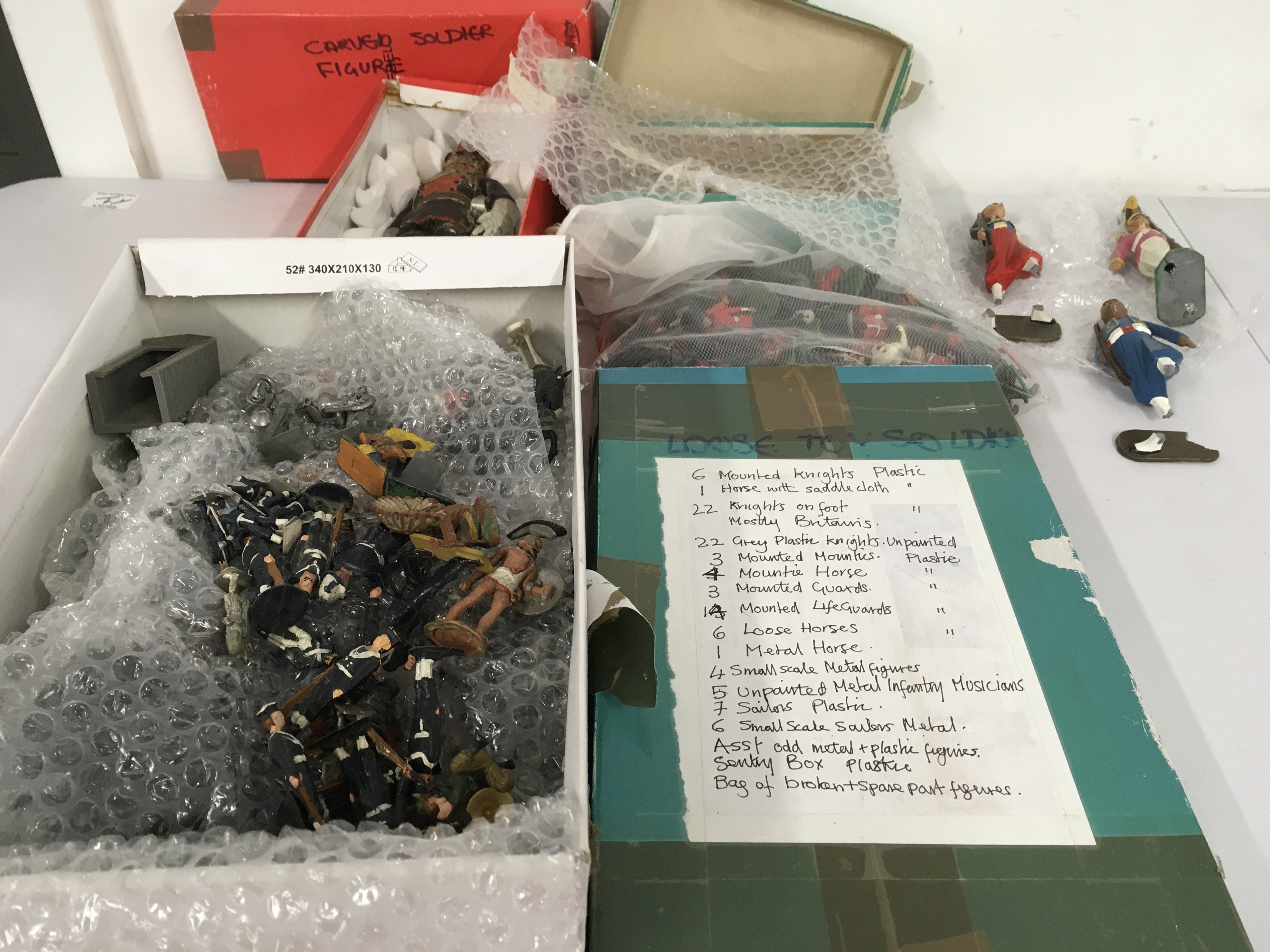 An assorted collection of loose Minature military figures in wood&hellip;plastic and metal by manufactured by Britains and others. Some damaged. No reserve. (3)