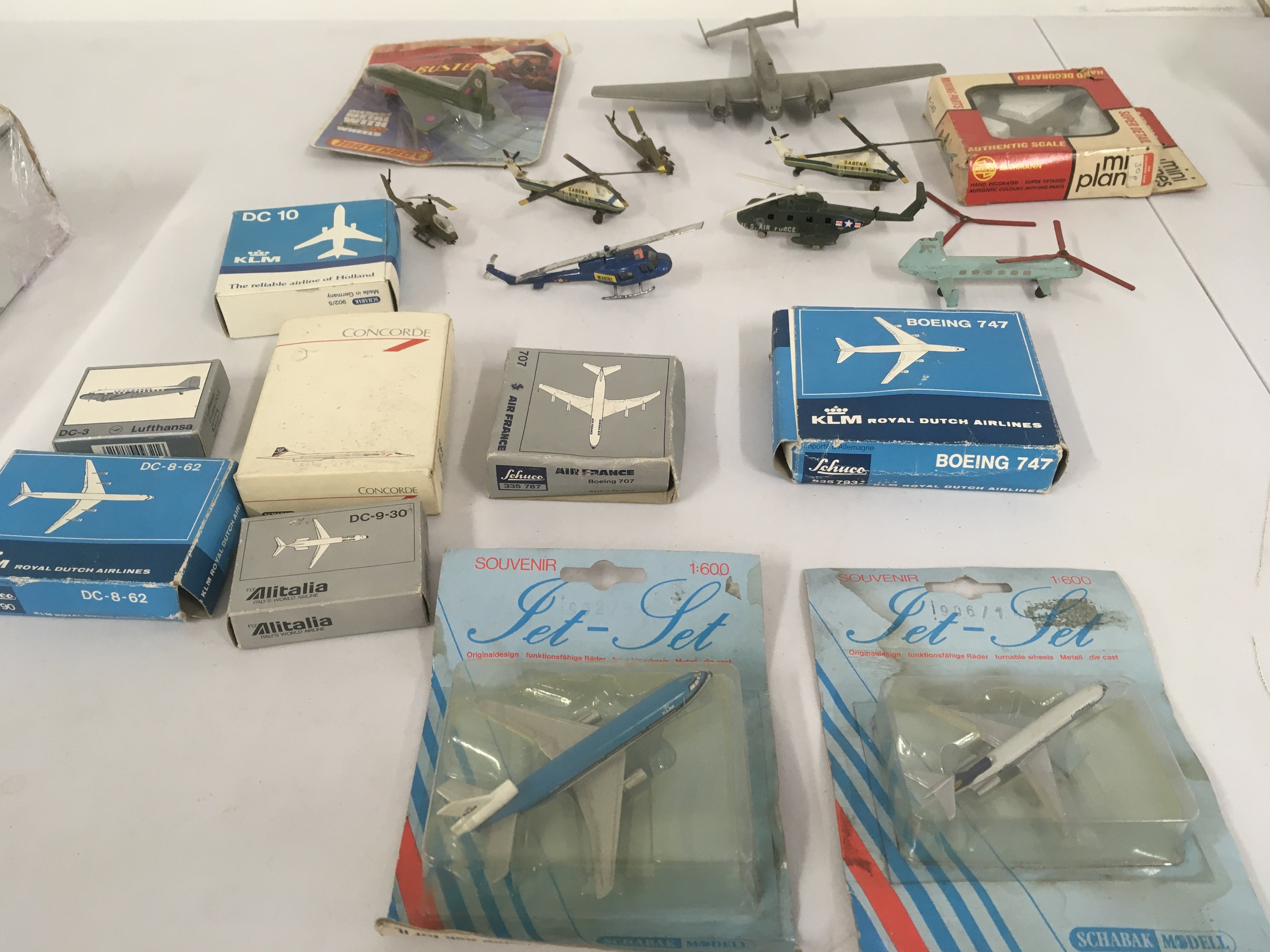 A mixed collection of diecast..plastic aeroplanes and helicopters by various manufacturers some used a promotional items. Some need repair. Many in original packaging. No reserve.