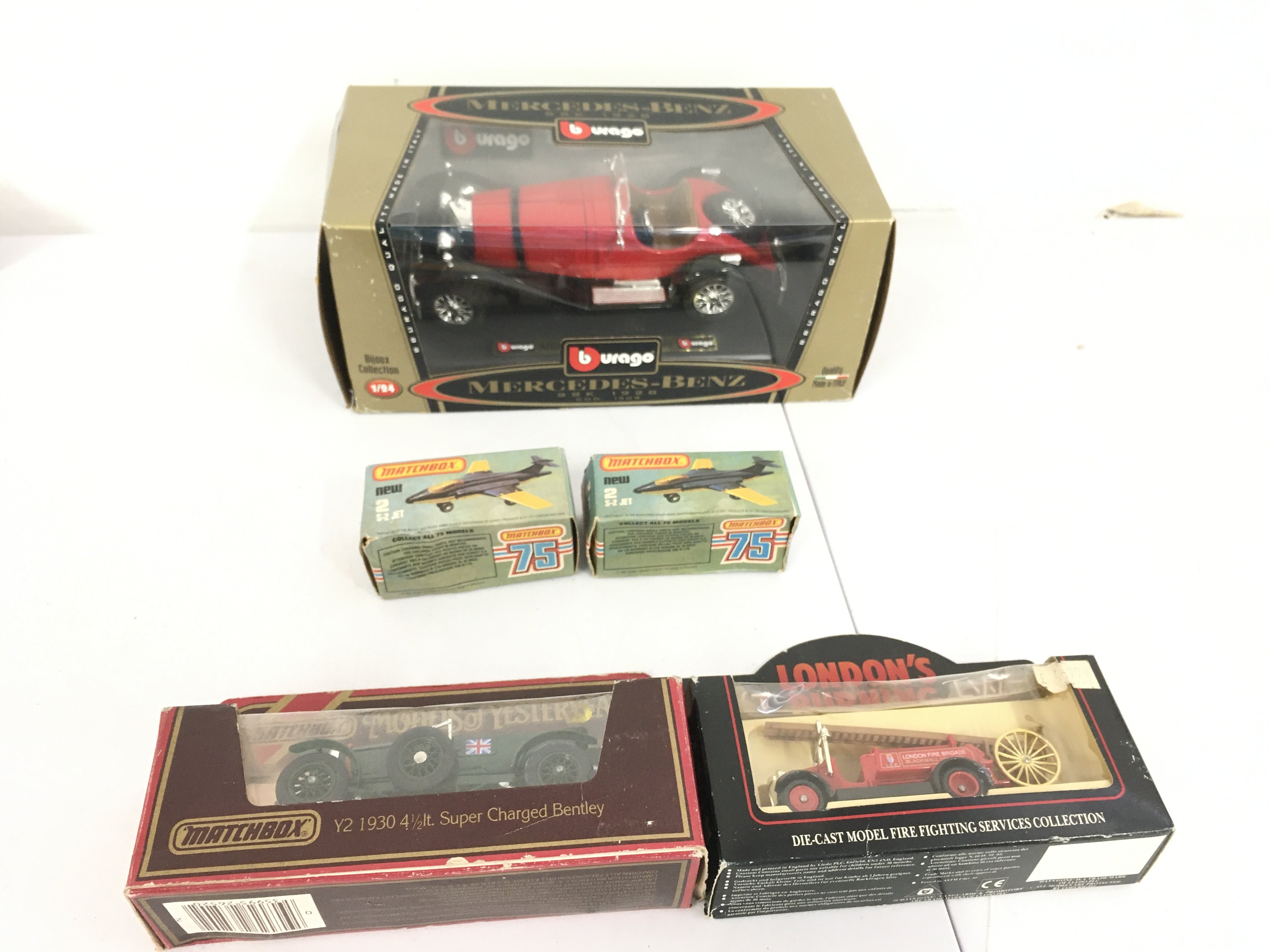A pair of boxed vintage Matchbox 75 jet planes 2. S2 jet. Also includes Burago boxed Mercedes 1928 SSK. Plus 2 other boxed cars by matchbox and Lledo. No reserve