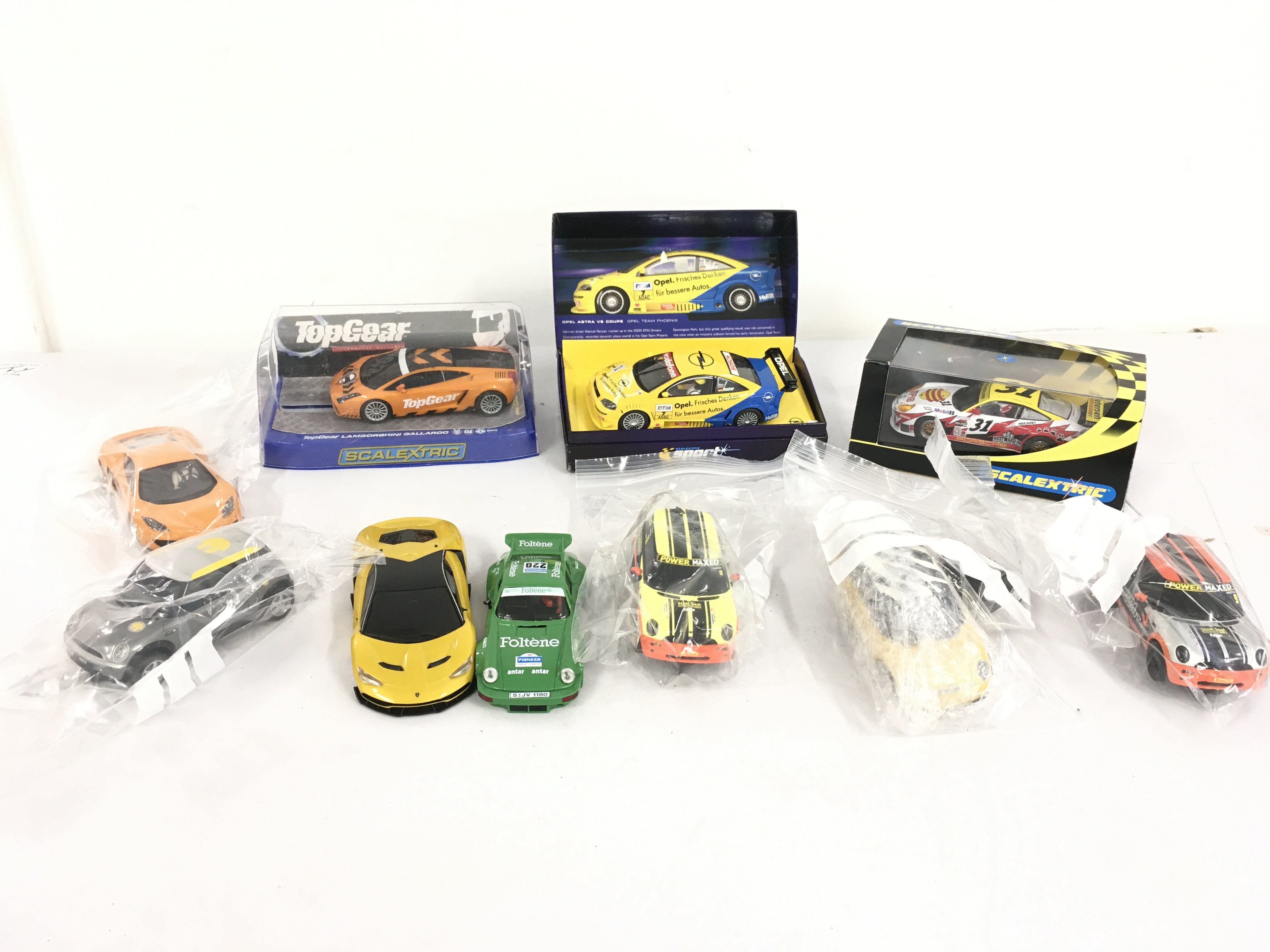 A collection of 10 Scalextric cars some race ready others for spares or repair. No reserve