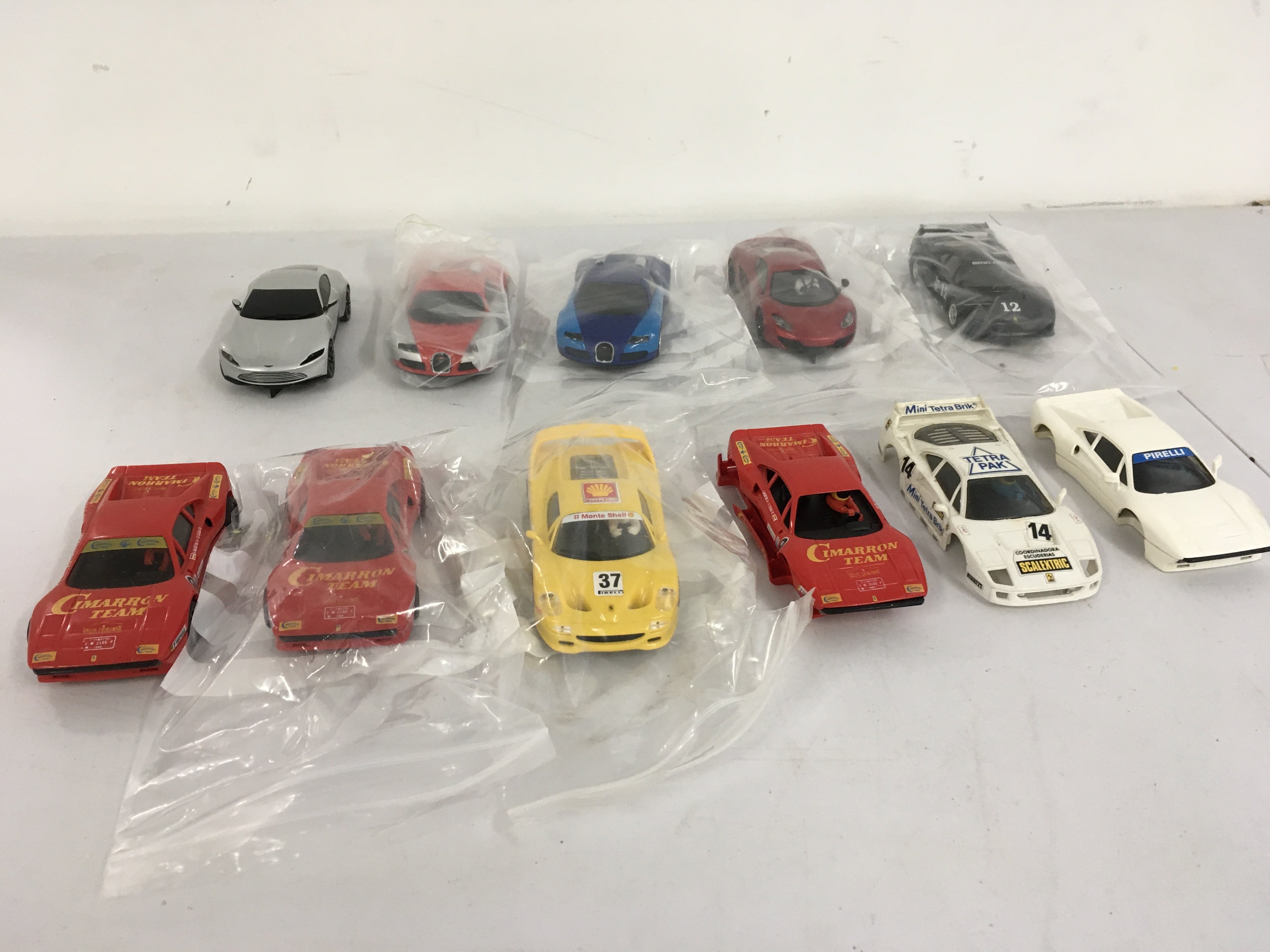 A collection of Scalextric cars some race ready others for spares or repair. No reserve.