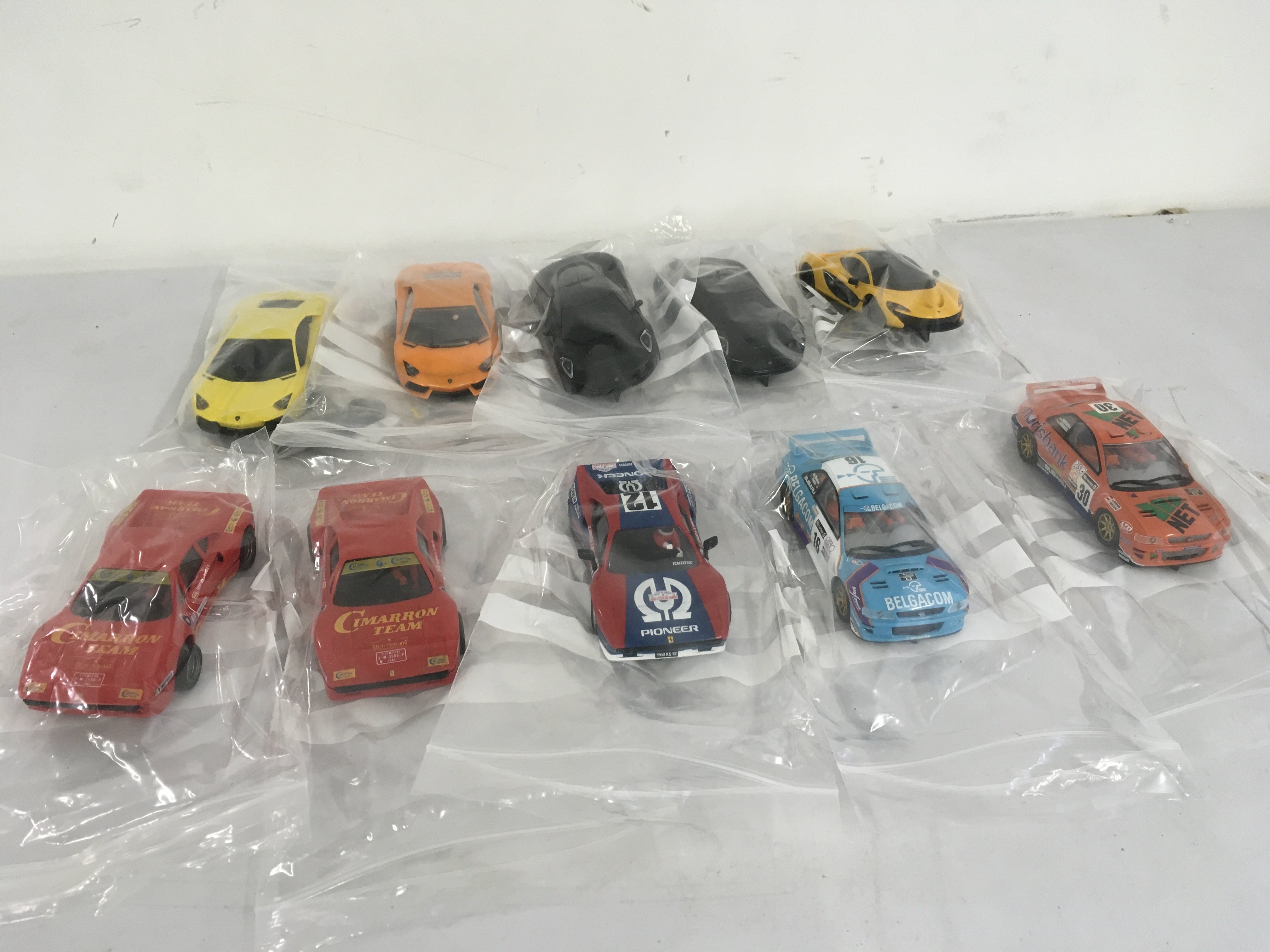 A collection of 10 Scalextric cars.