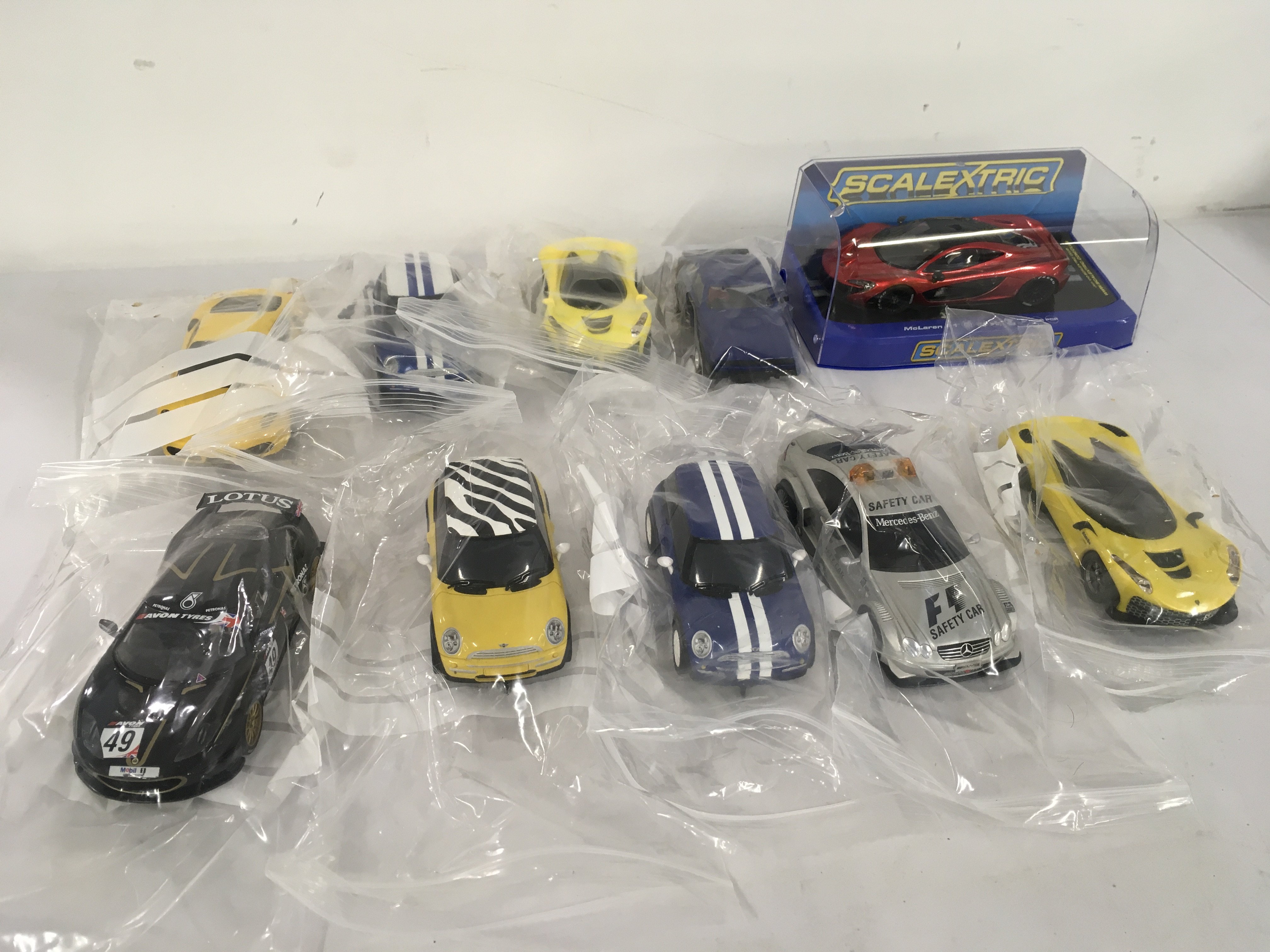 A collection of used Scalextric..Hornby model cars including a boxed McLaren P1. No reserve