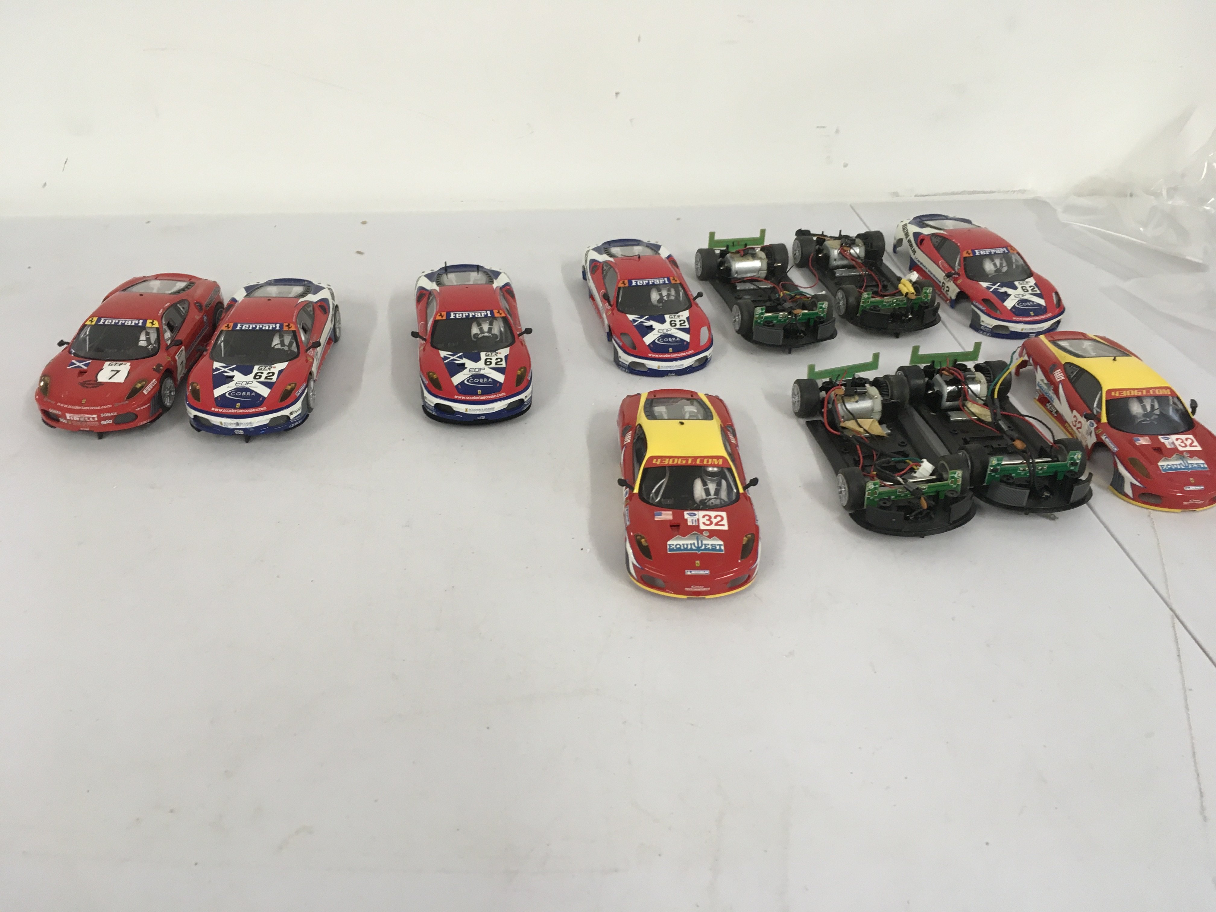 A collection of 7 Hornby slot racing cars some ready to run others for spares or repairs. No reserve