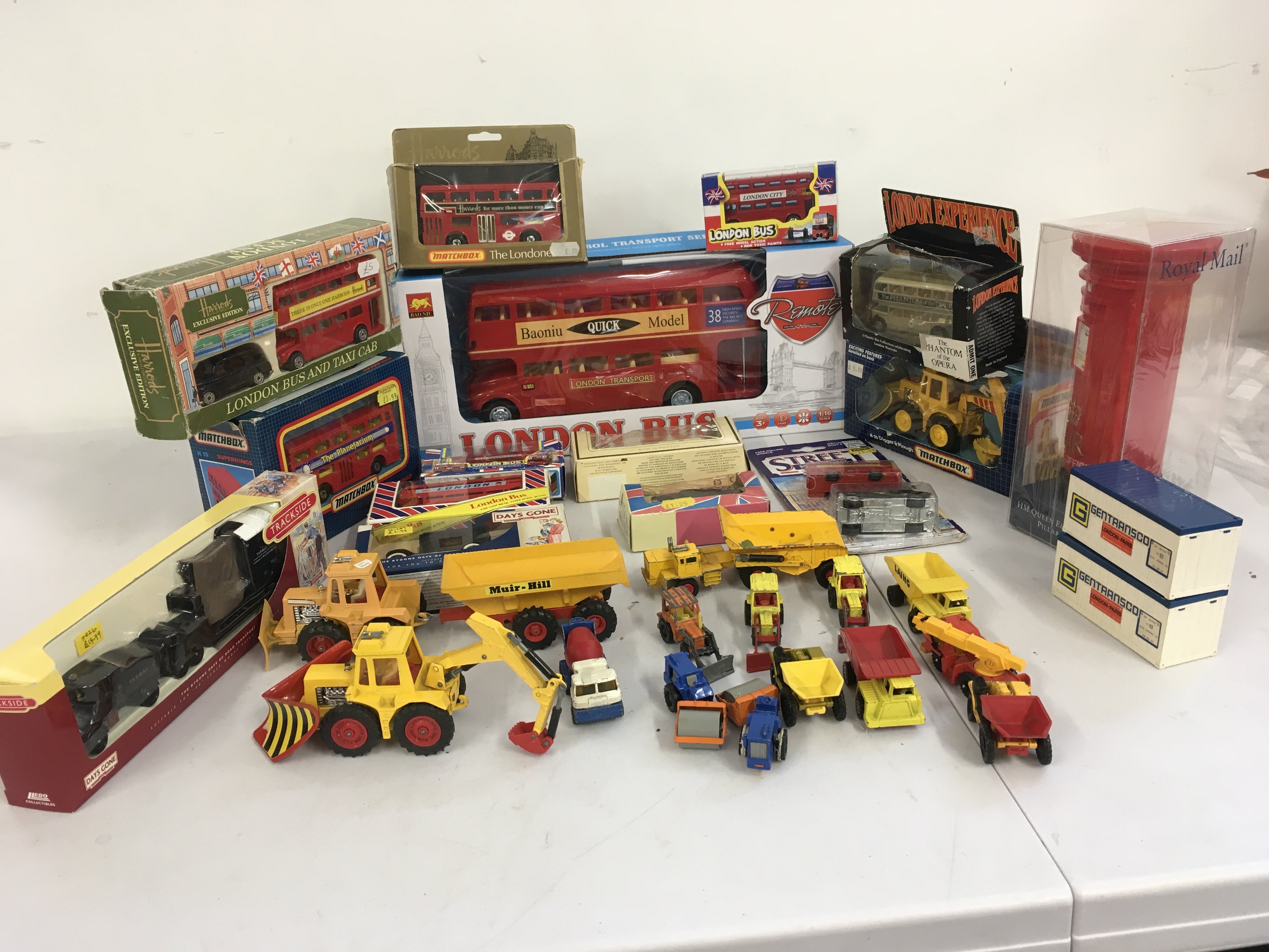 A collection of boxed and loose Playworn diecast and plastic model vehicles predominantly buses and construction. Large remote control bus. Manufacturers include Matchbox..Lledo etc. no reserve